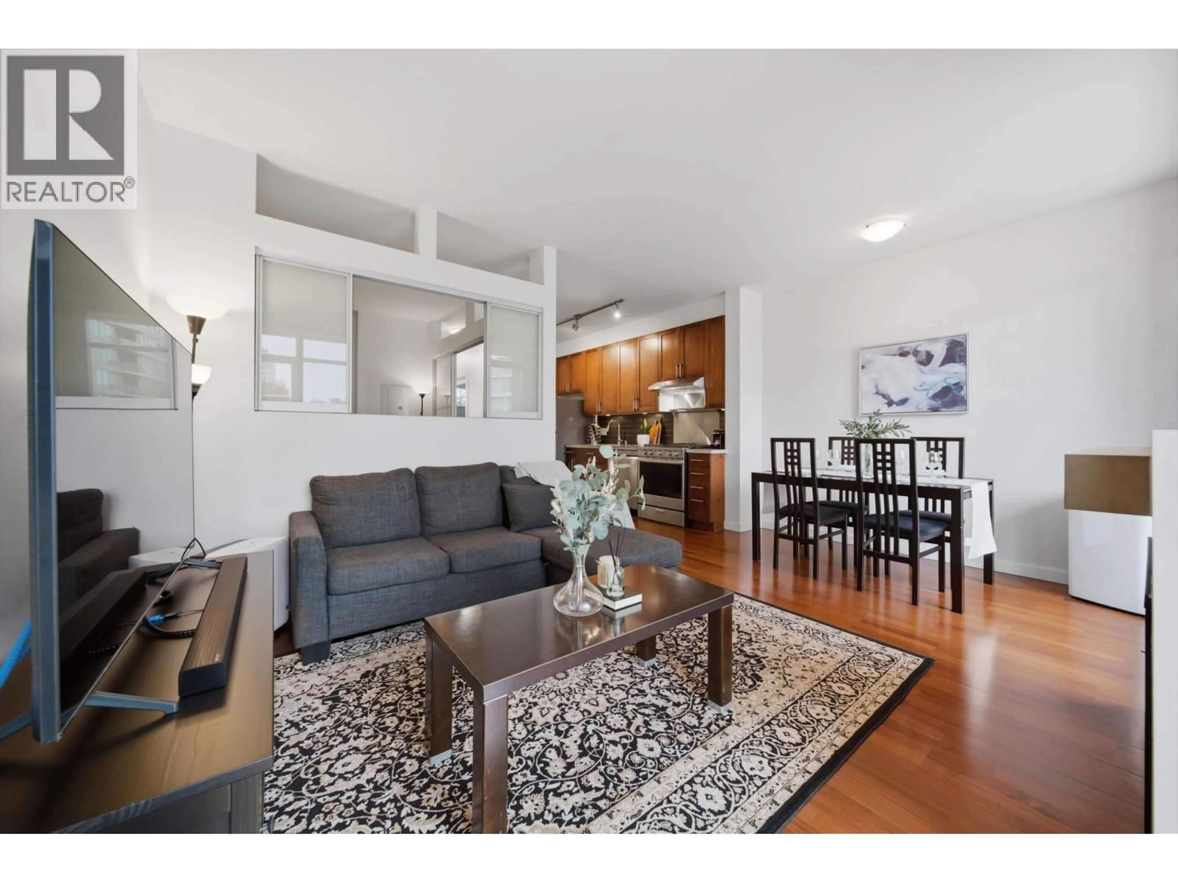 Living room with furniture, wood/laminate floor for 306 - 2055 YUKON STREET, Vancouver British Columbia V5Y4B7