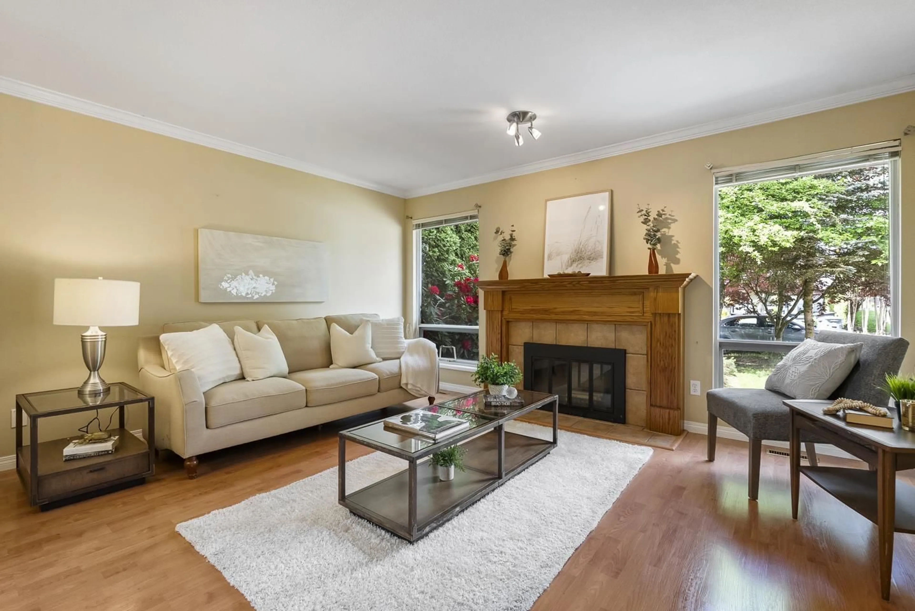 Living room with furniture, wood/laminate floor for 8068 161A STREET, Surrey British Columbia V3S8B5