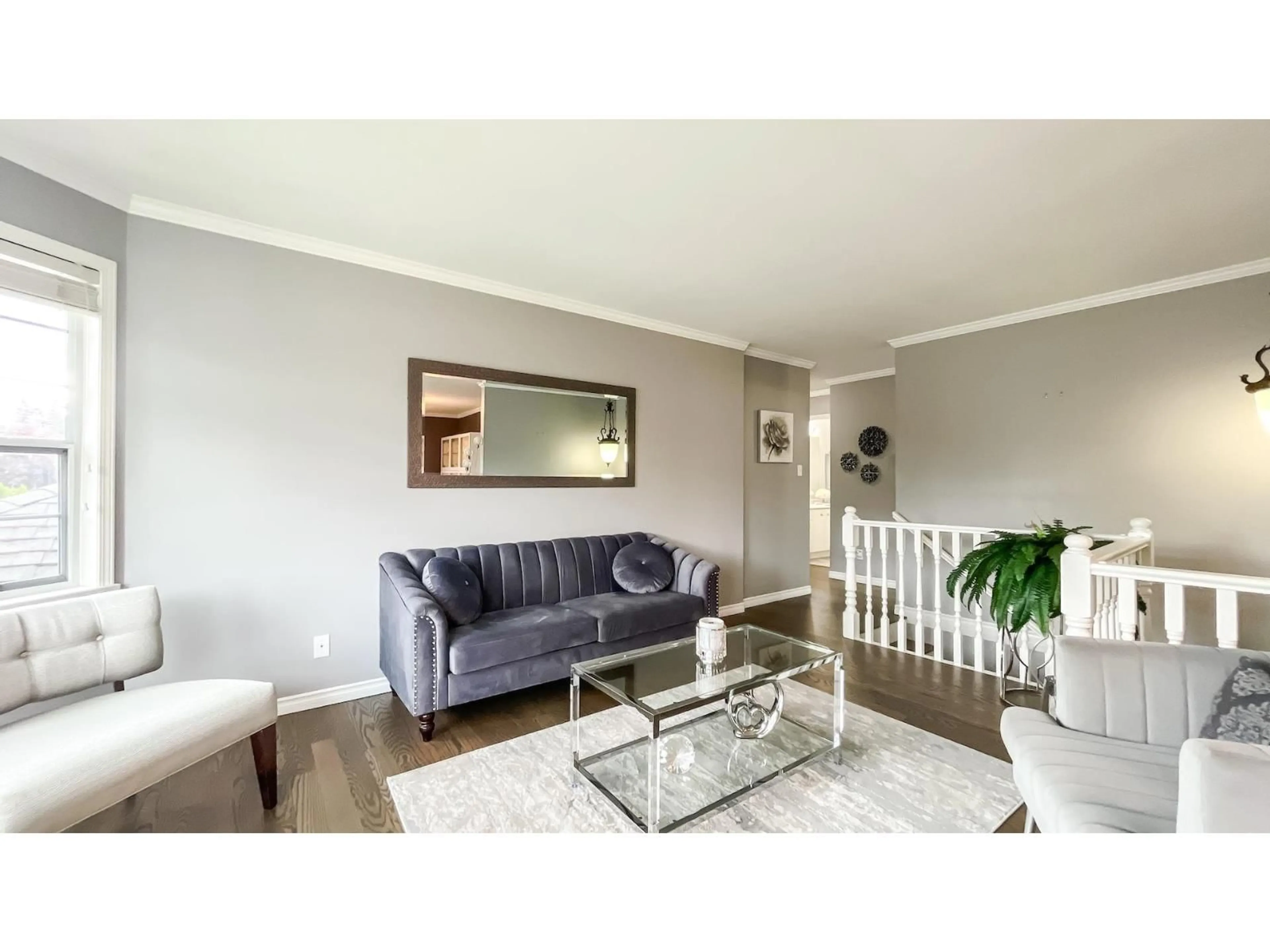 Living room with furniture, wood/laminate floor for 8095 158 STREET, Surrey British Columbia V4N0S6