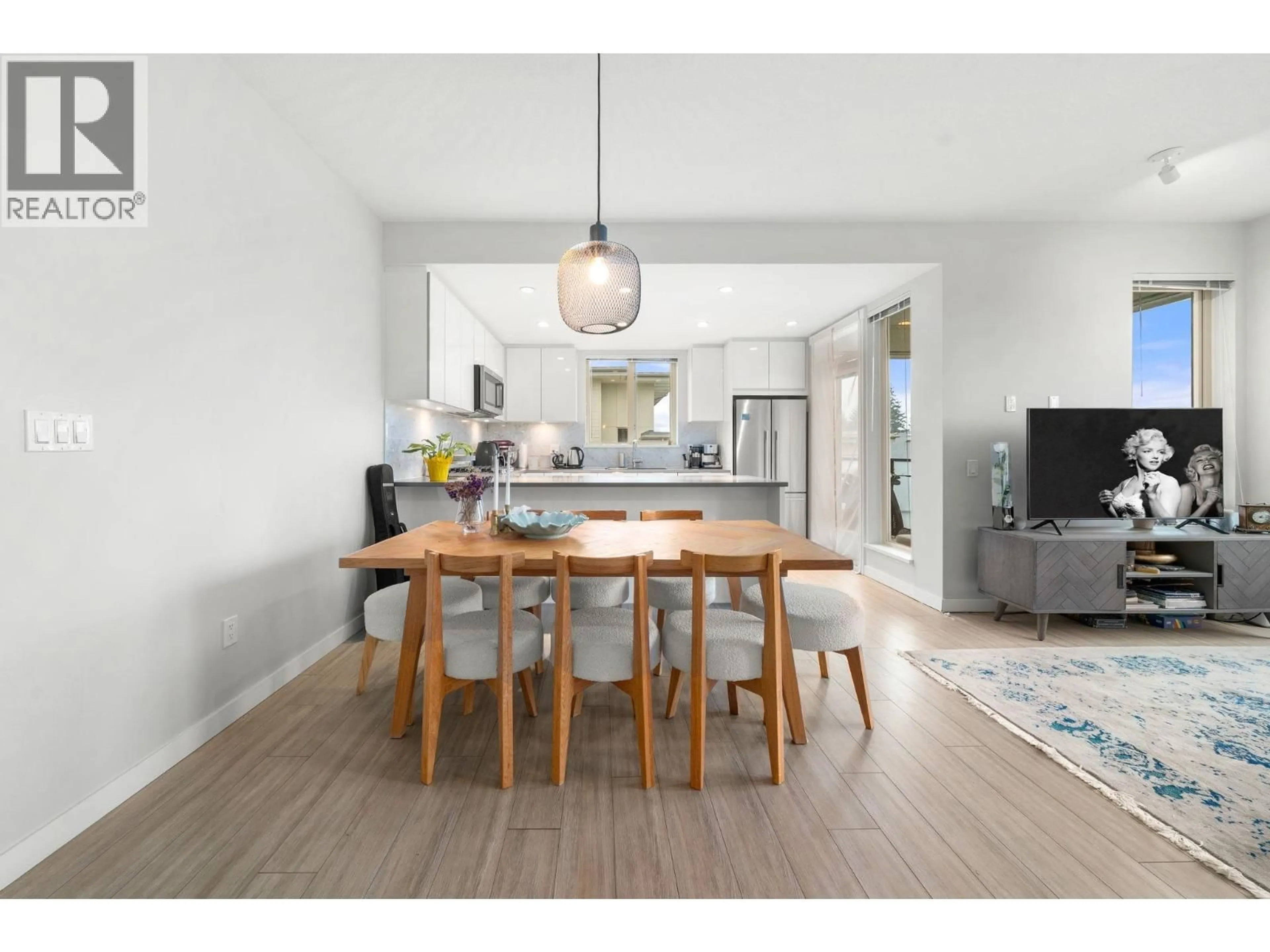 Open concept kitchen, wood/laminate floor for 503 - 2632 LIBRARY LANE, North Vancouver British Columbia V7J0B8
