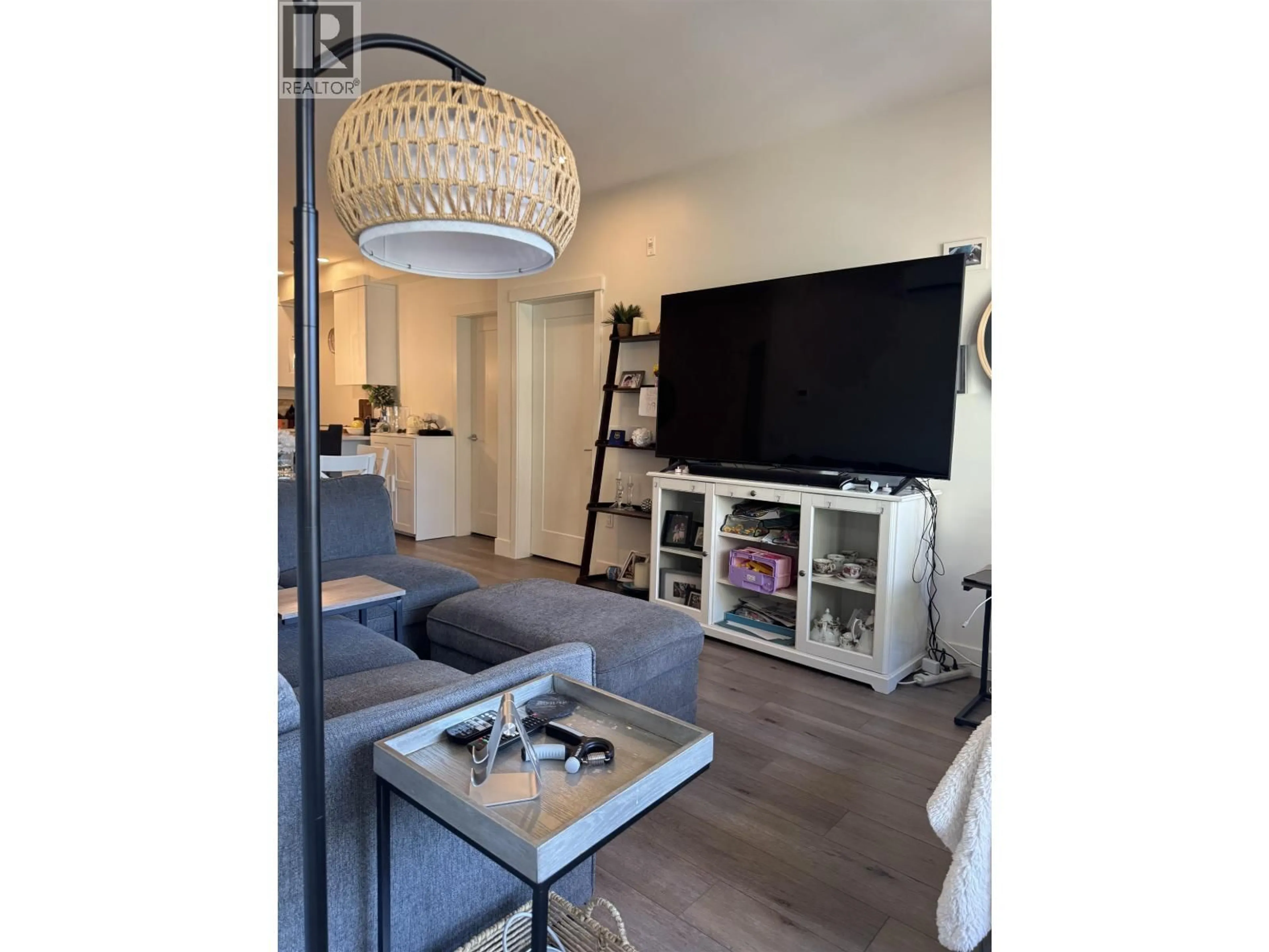 Living room with furniture, wood/laminate floor for 411 - 11865 227 STREET, Maple Ridge British Columbia V2X6H9