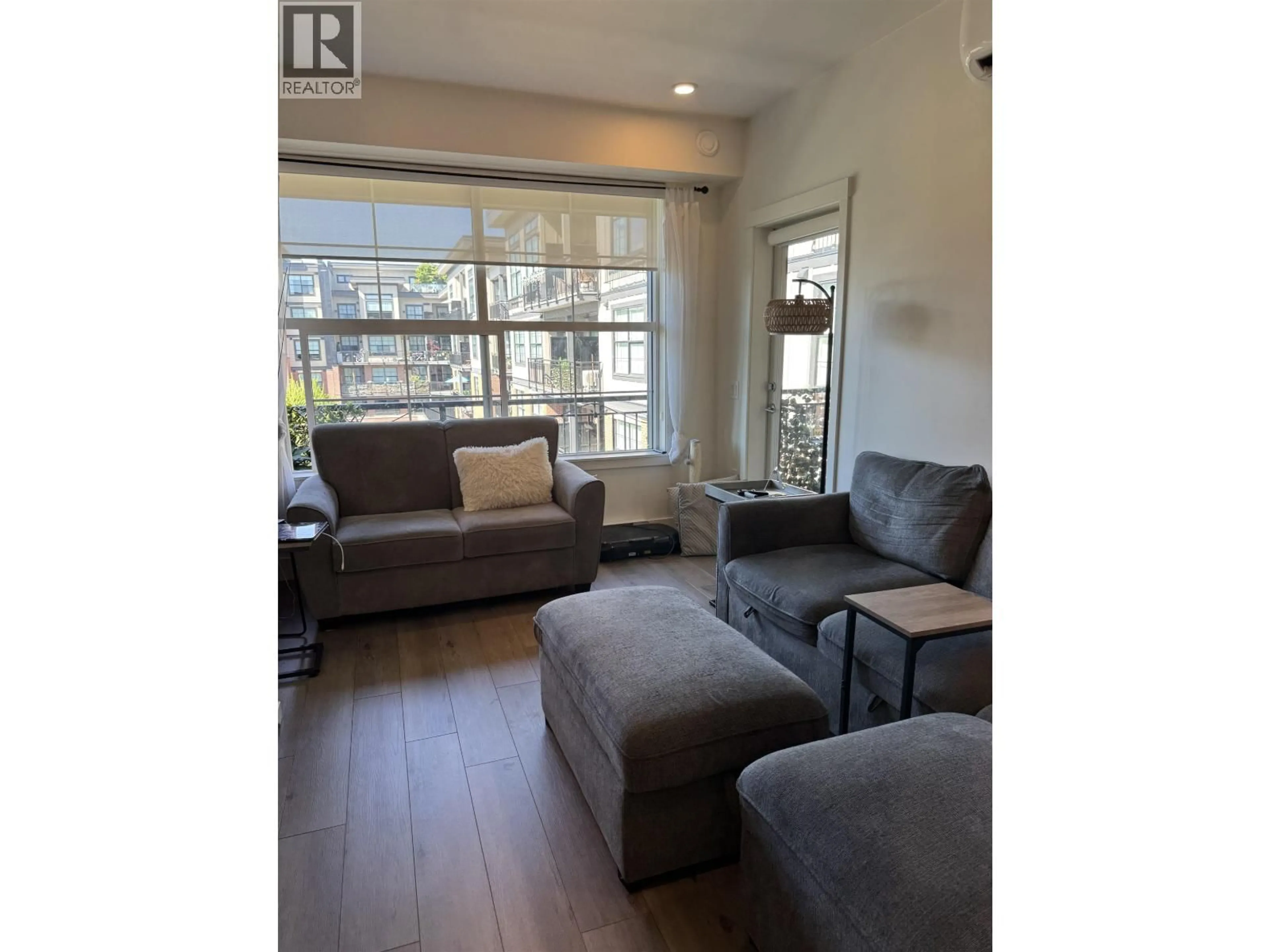 Living room with furniture, wood/laminate floor for 411 - 11865 227 STREET, Maple Ridge British Columbia V2X6H9