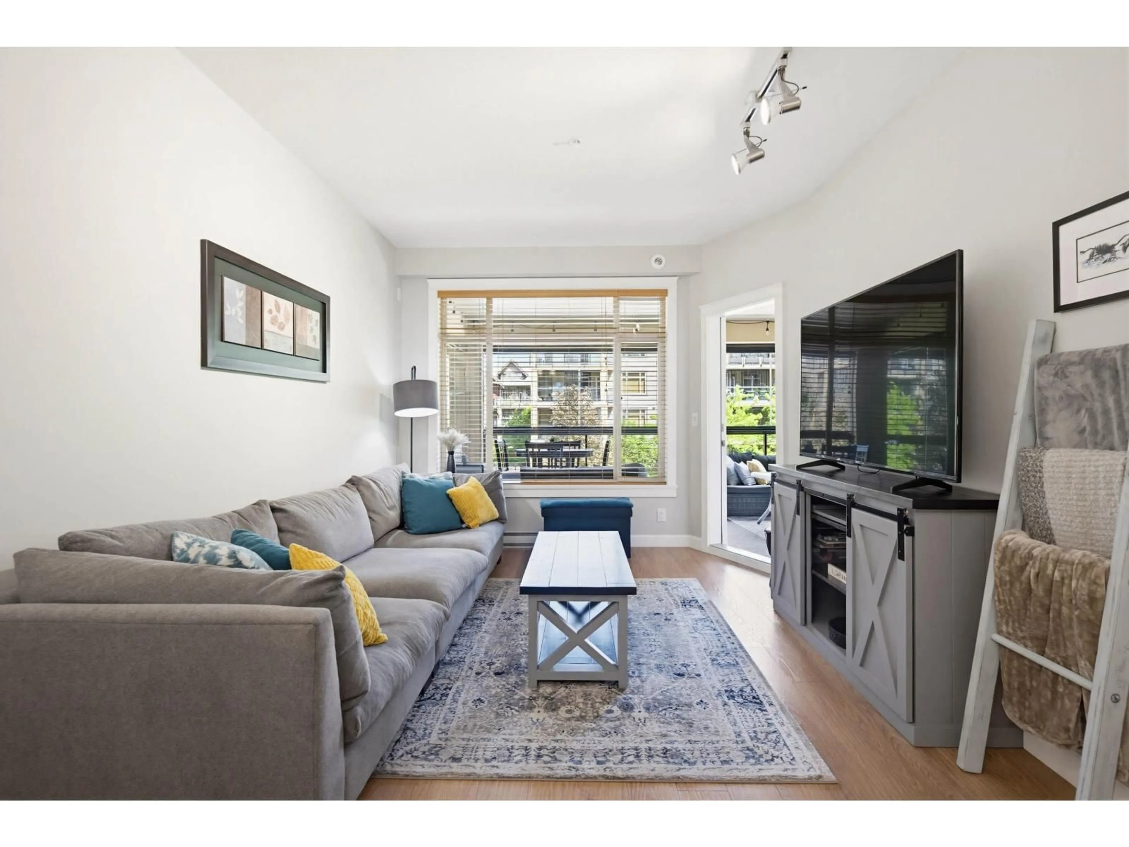 Living room with furniture, wood/laminate floor for 325 - 8218 207A STREET, Langley British Columbia V2Y0X9