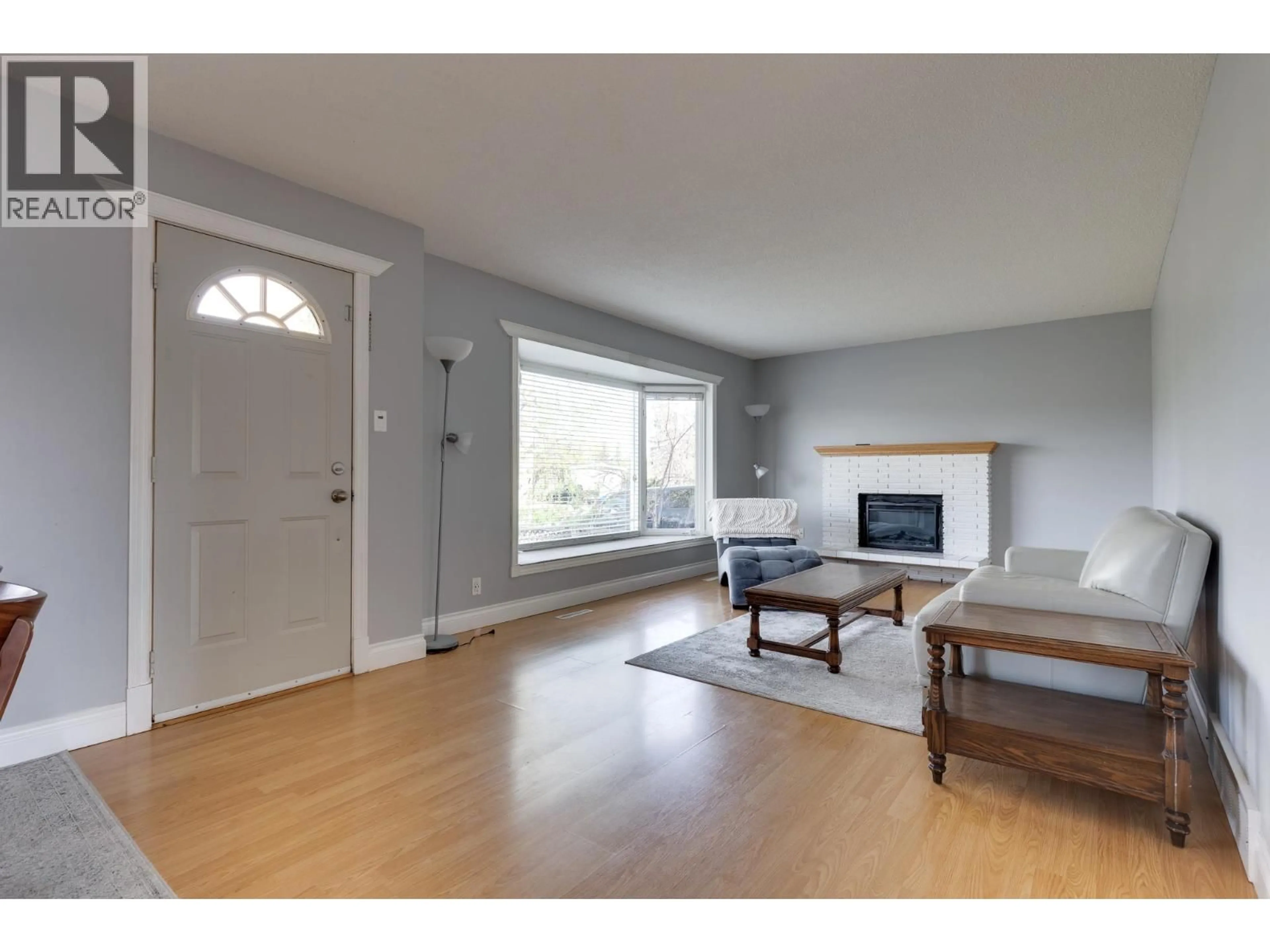 Living room with furniture, wood/laminate floor for 162 OGILVIE STREET, Prince George British Columbia V2M3M2