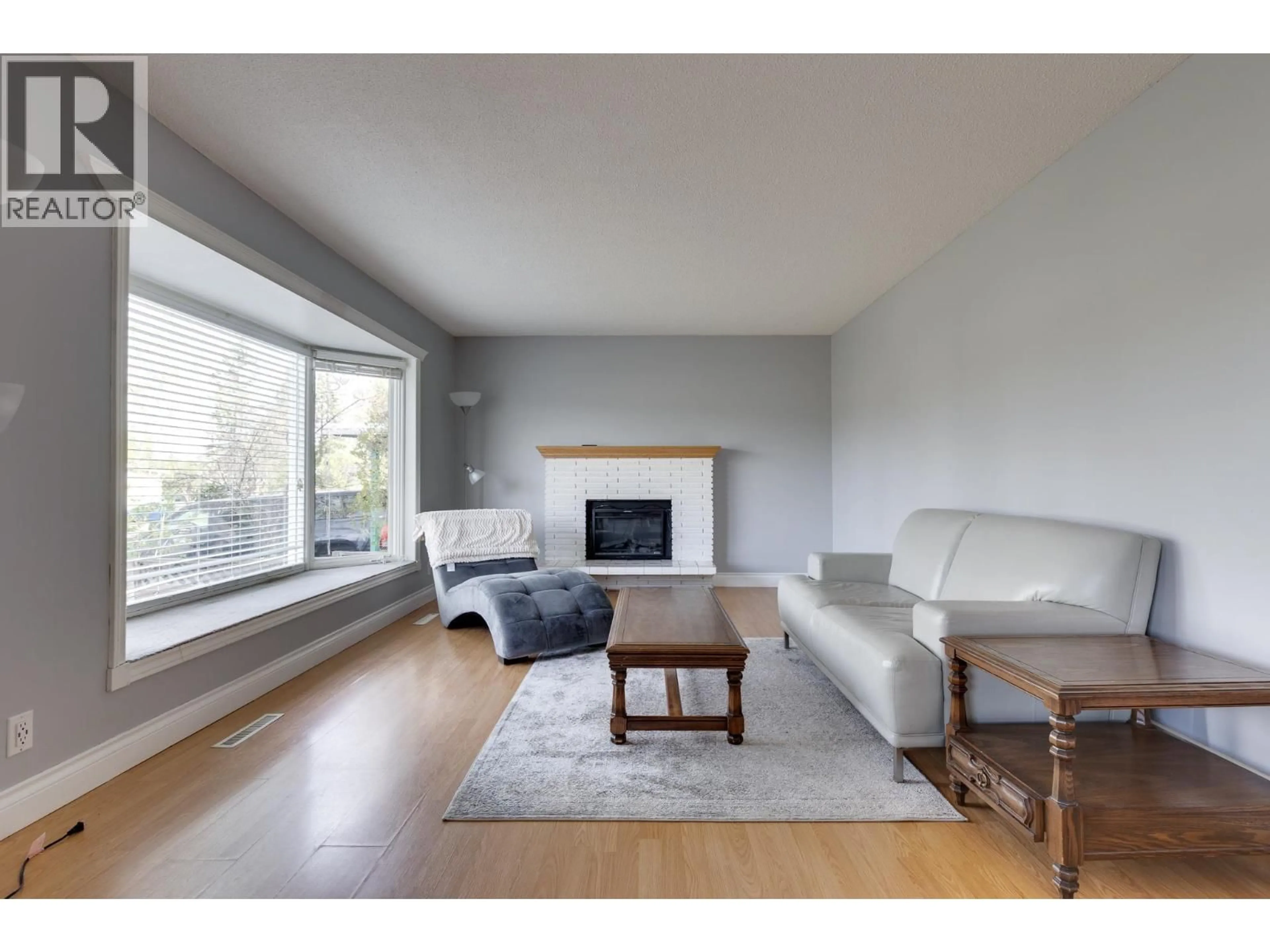 Living room with furniture, wood/laminate floor for 162 OGILVIE STREET, Prince George British Columbia V2M3M2
