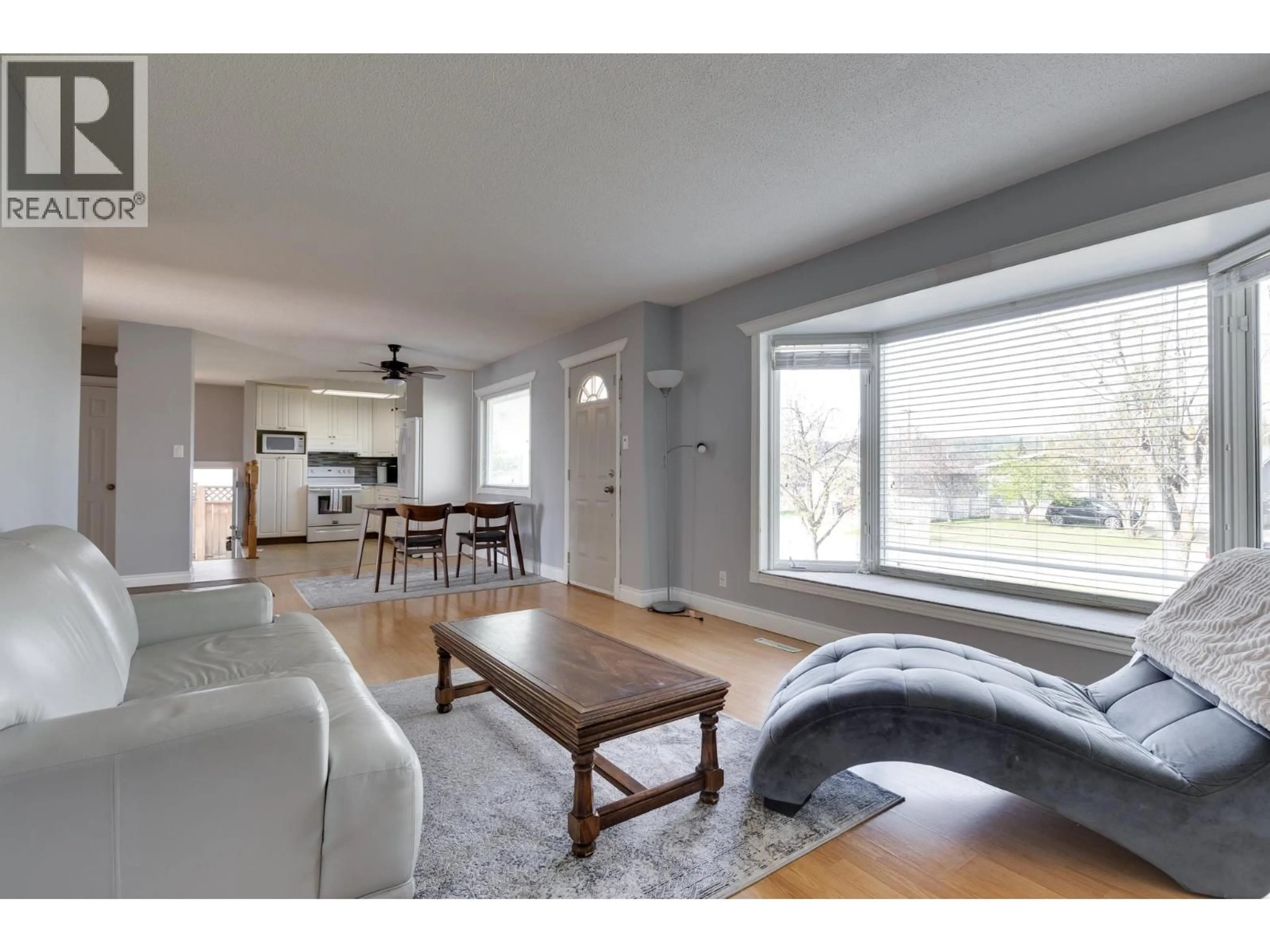 Living room with furniture, wood/laminate floor for 162 OGILVIE STREET, Prince George British Columbia V2M3M2