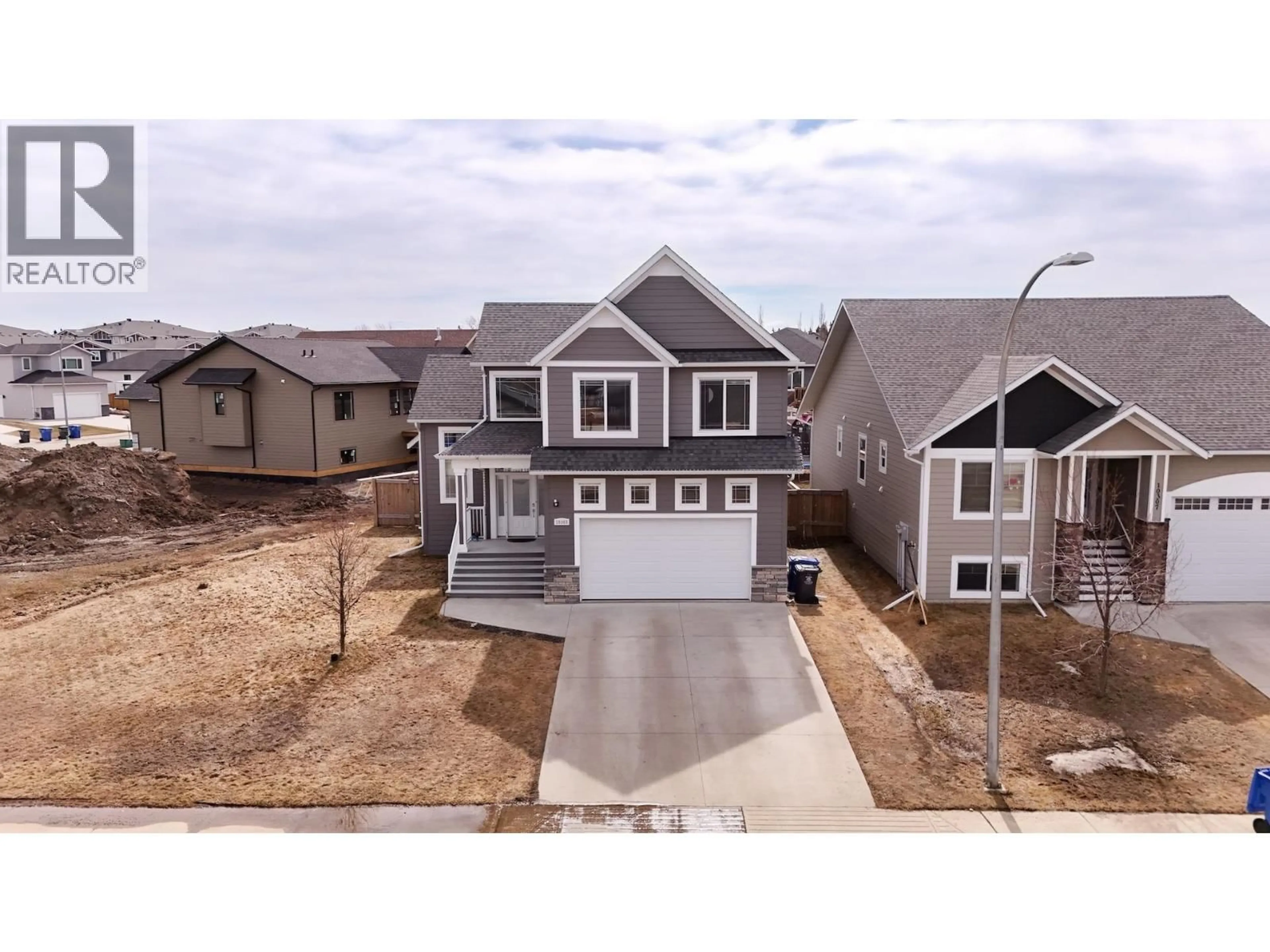A pic from outside/outdoor area/front of a property/back of a property/a pic from drone, street for 10303 117 AVENUE, Fort St. John British Columbia V1J0M8