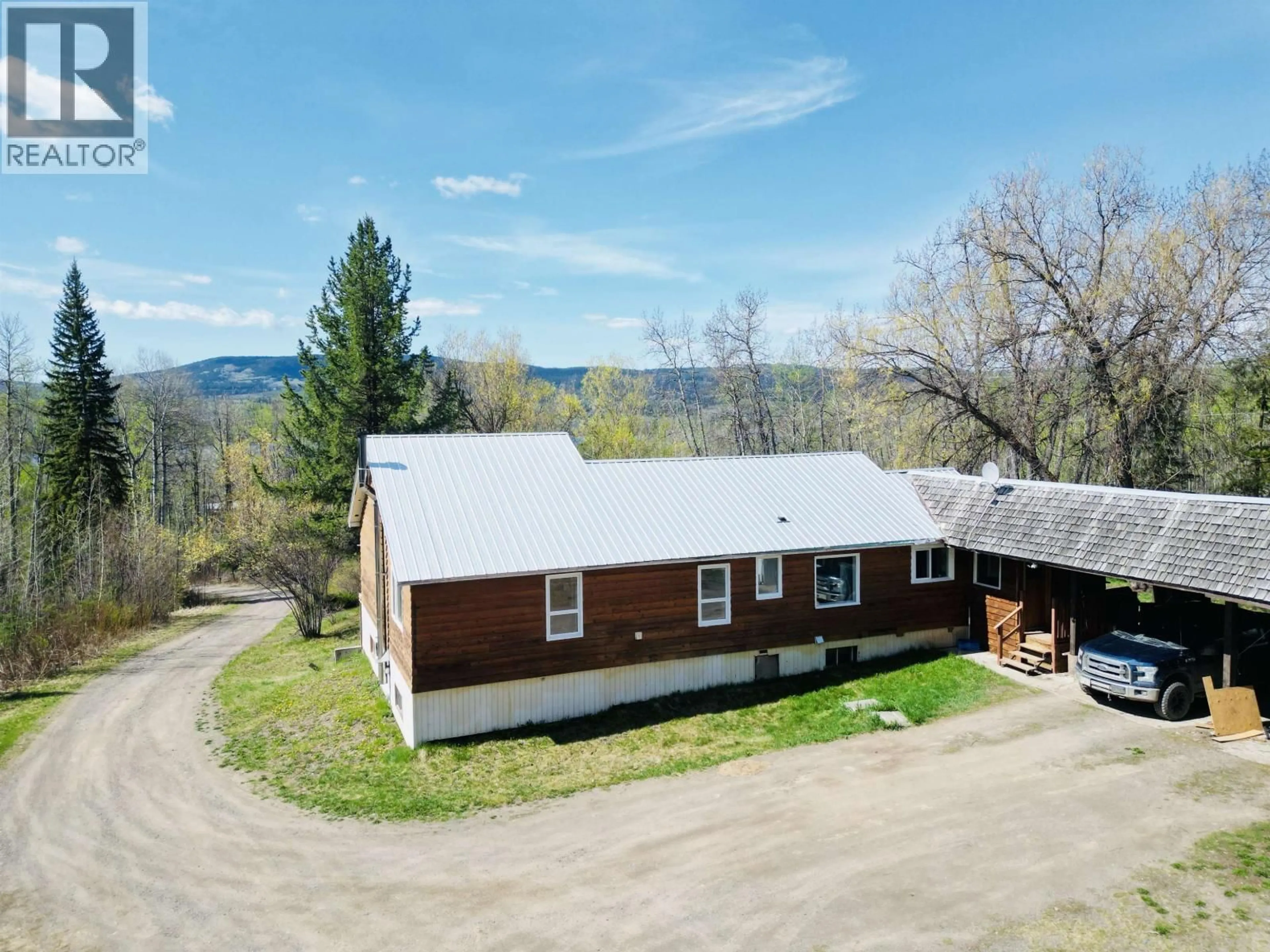 A pic from outside/outdoor area/front of a property/back of a property/a pic from drone, mountain view for 2500 BENNETT ROAD, Burns Lake British Columbia V0J1E1