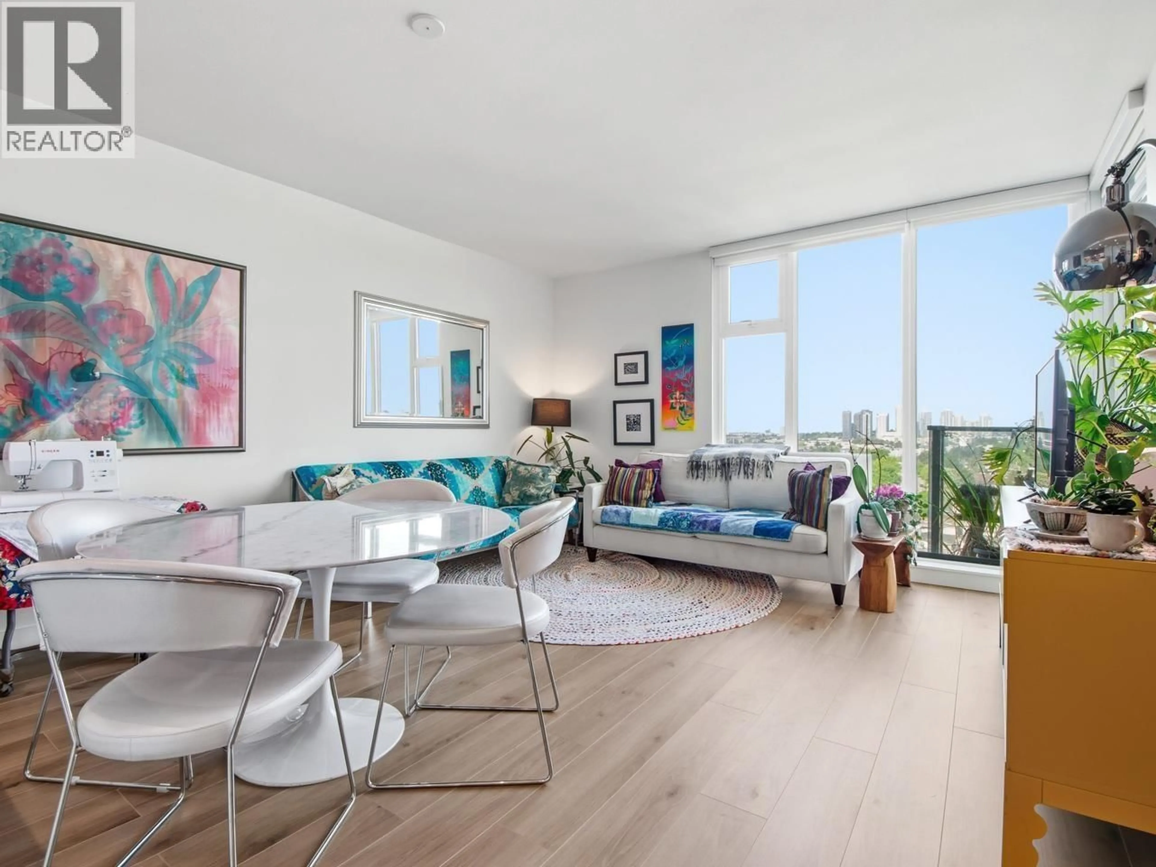 Living room with furniture, wood/laminate floor for 1304 - 8188 FRASER STREET, Vancouver British Columbia V5X0J8