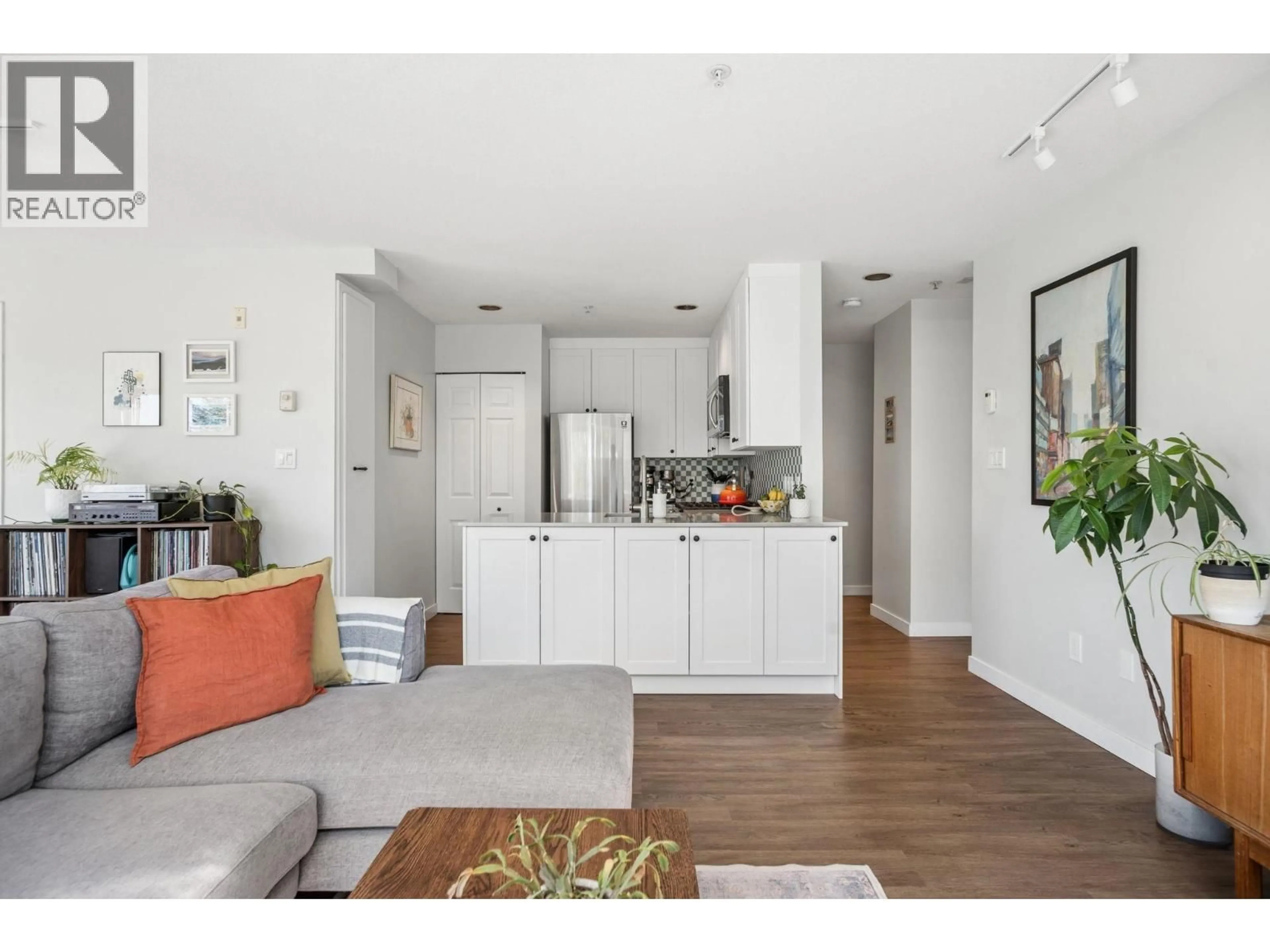 Open concept kitchen, wood/laminate floor for 302 - 1510 GRANT STREET, Vancouver British Columbia V5L2Y2