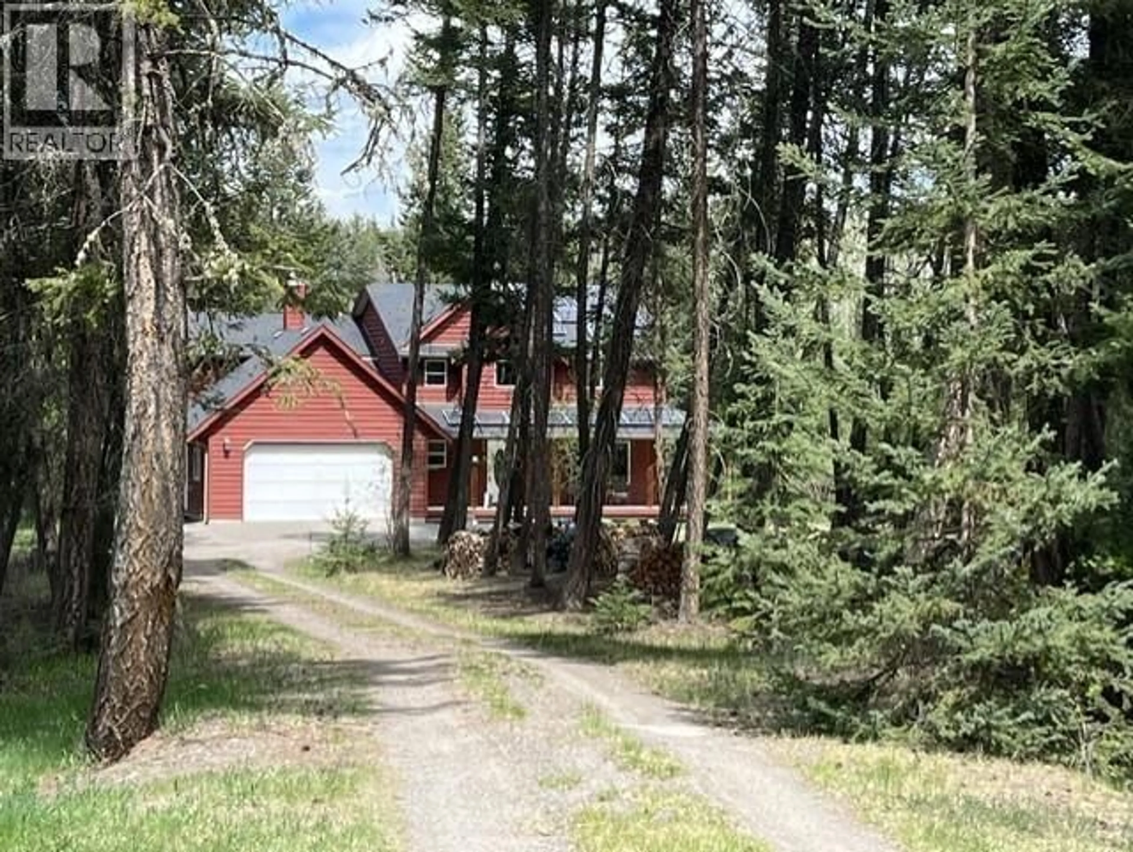 A pic from outside/outdoor area/front of a property/back of a property/a pic from drone, forest/trees view for 5369 KALLUM DRIVE, 108 Mile Ranch British Columbia V0K2Z0