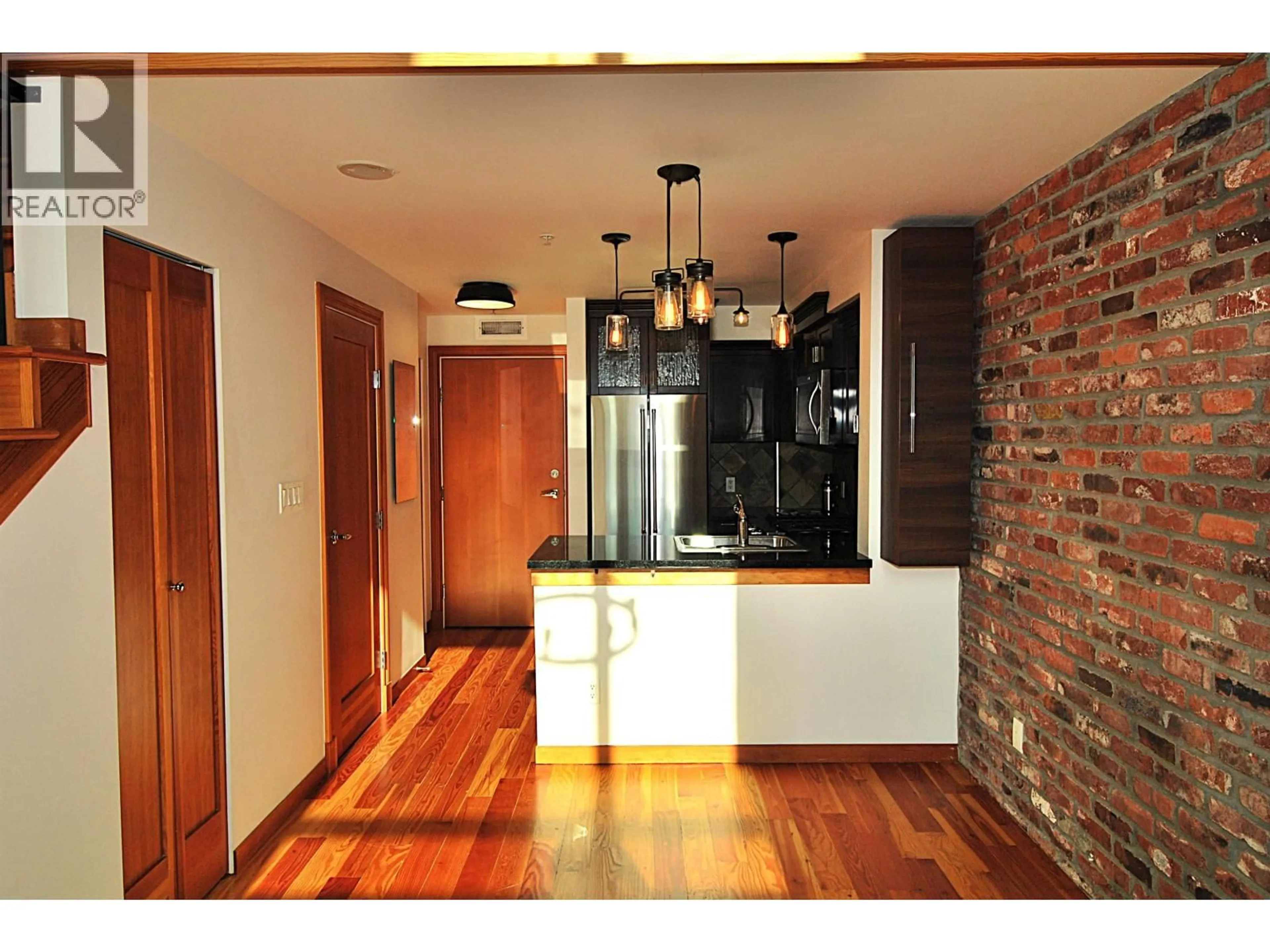 Open concept kitchen, wood/laminate floor for 404 - 10 RENAISSANCE SQUARE, New Westminster British Columbia V3M7B1