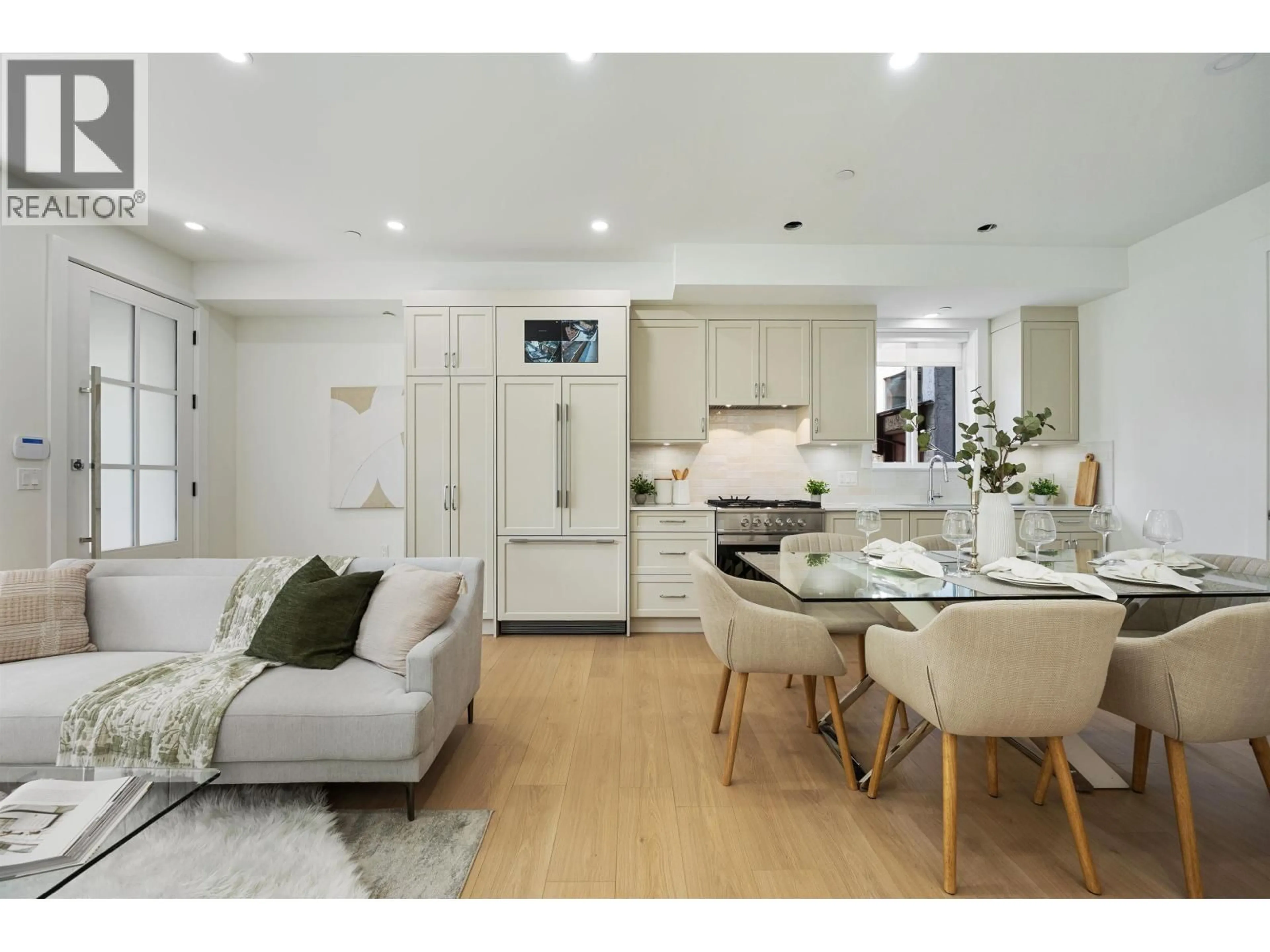 Open concept kitchen, wood/laminate floor for 1 - 2447 41 AVENUE, Vancouver British Columbia V5R2W2