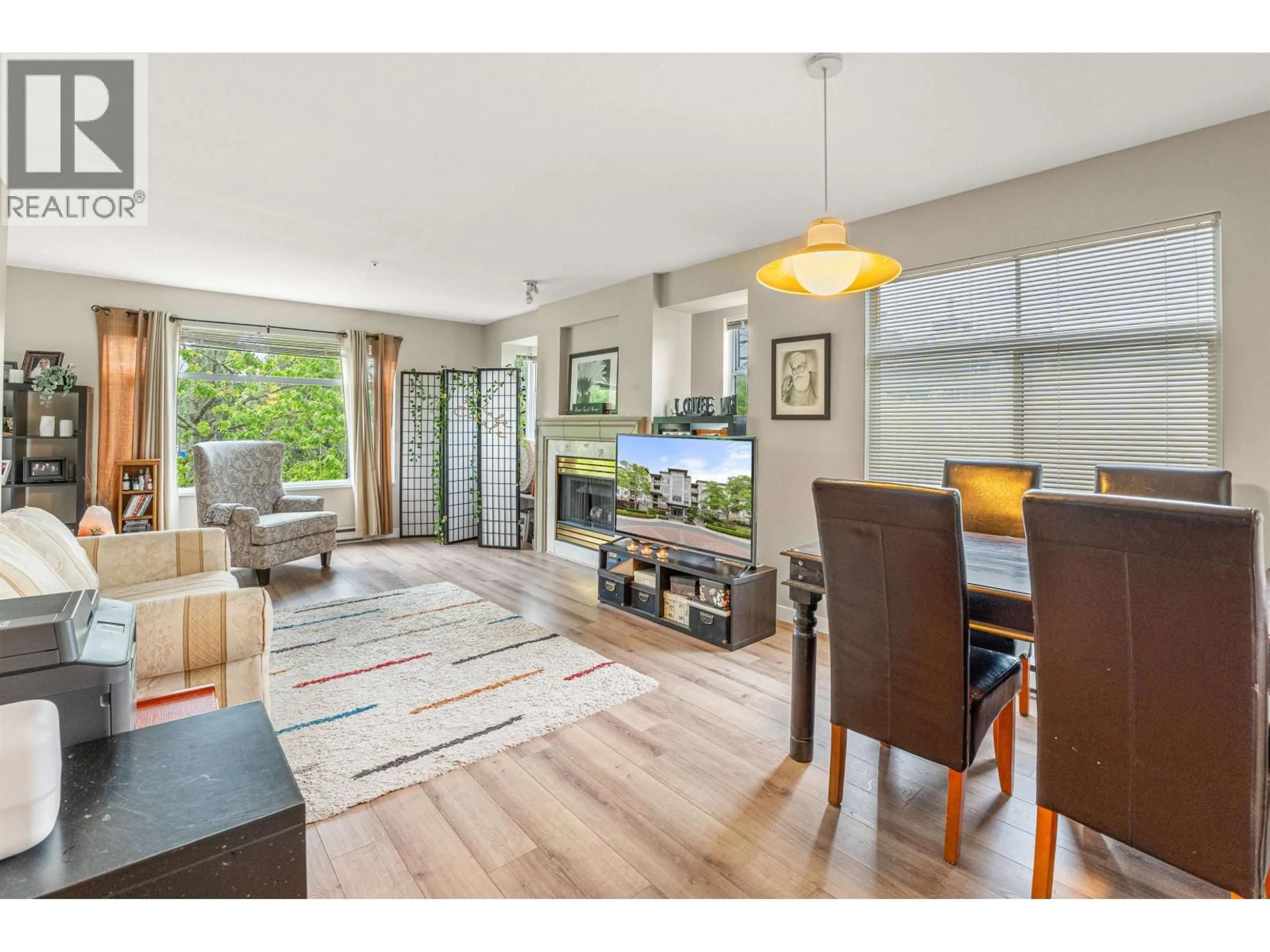 Living room with furniture, wood/laminate floor for 216 - 8220 JONES ROAD, Richmond British Columbia V6Y3Z7