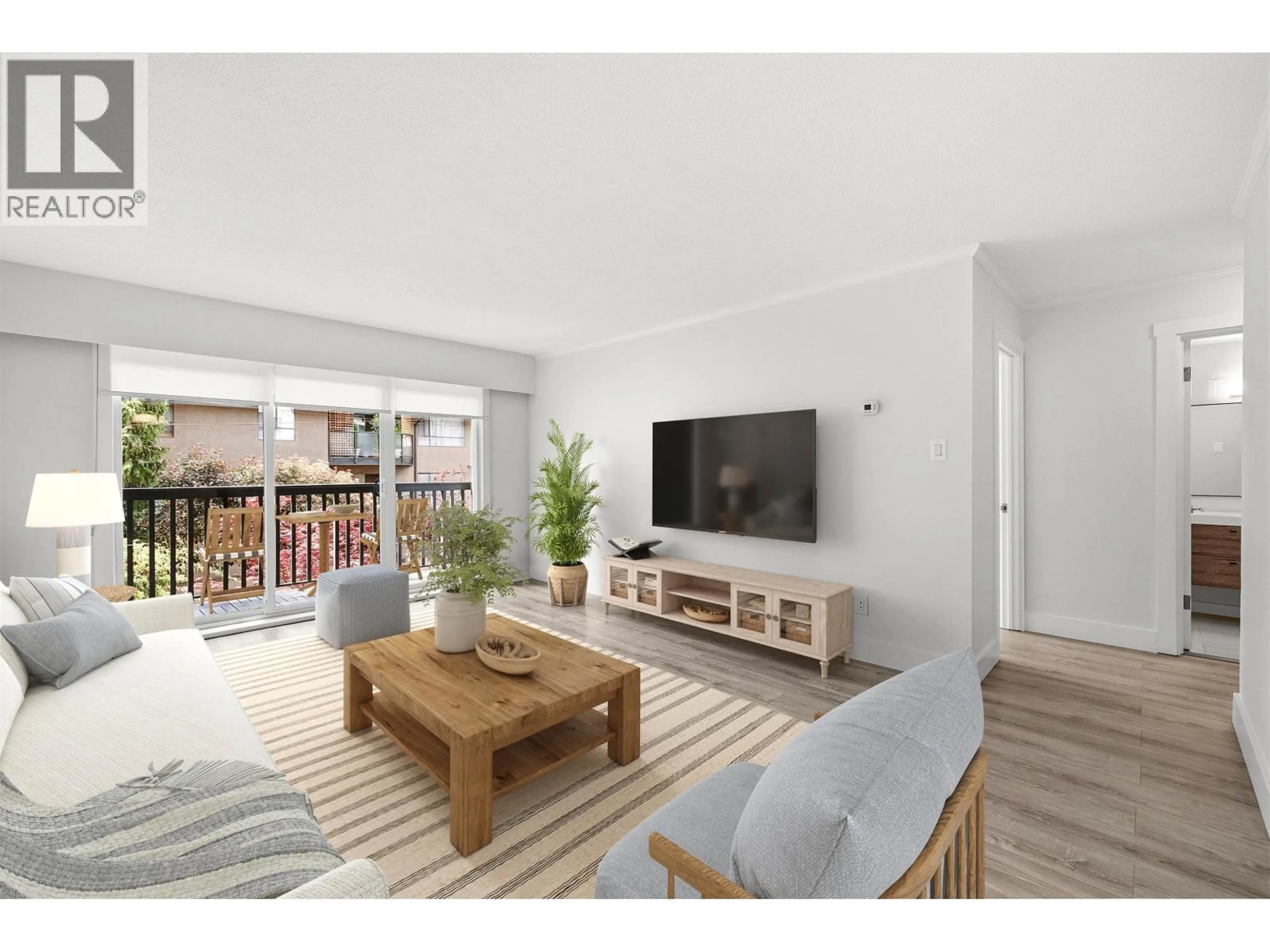 Living room with furniture, wood/laminate floor for 112 - 211 3RD STREET, North Vancouver British Columbia V7M1E9
