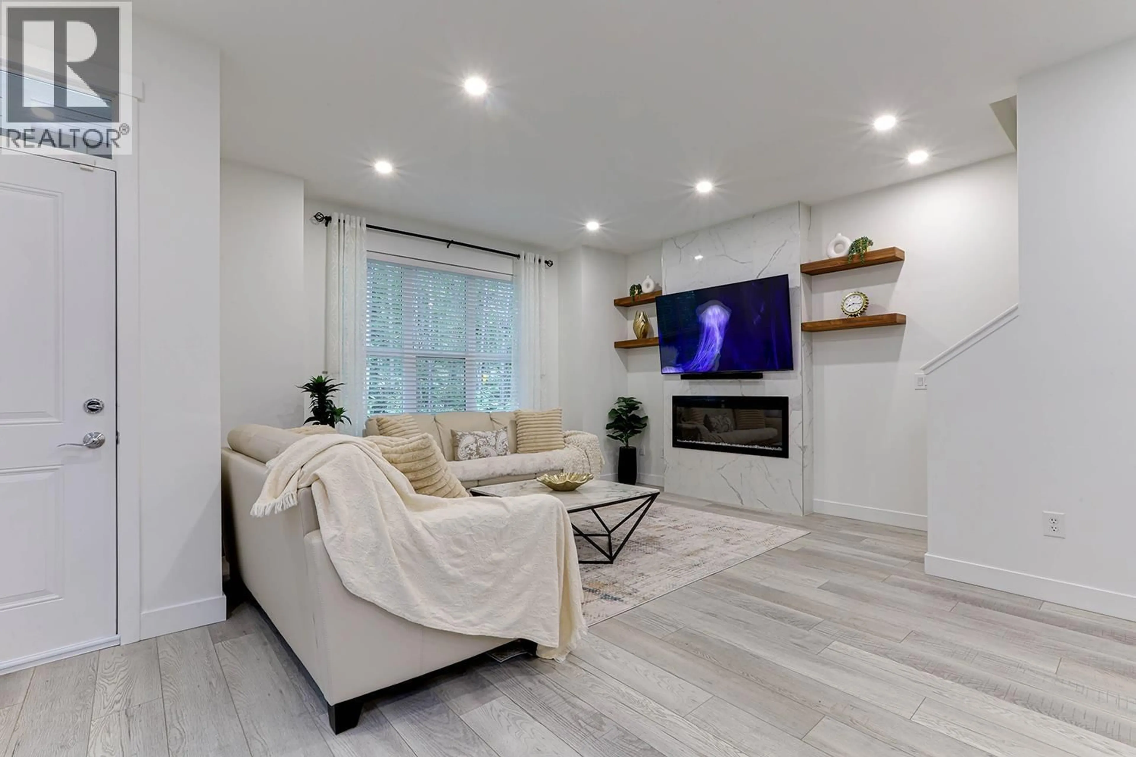 Living room with furniture, wood/laminate floor for 1437 COLLINS ROAD, Coquitlam British Columbia V3E0A9