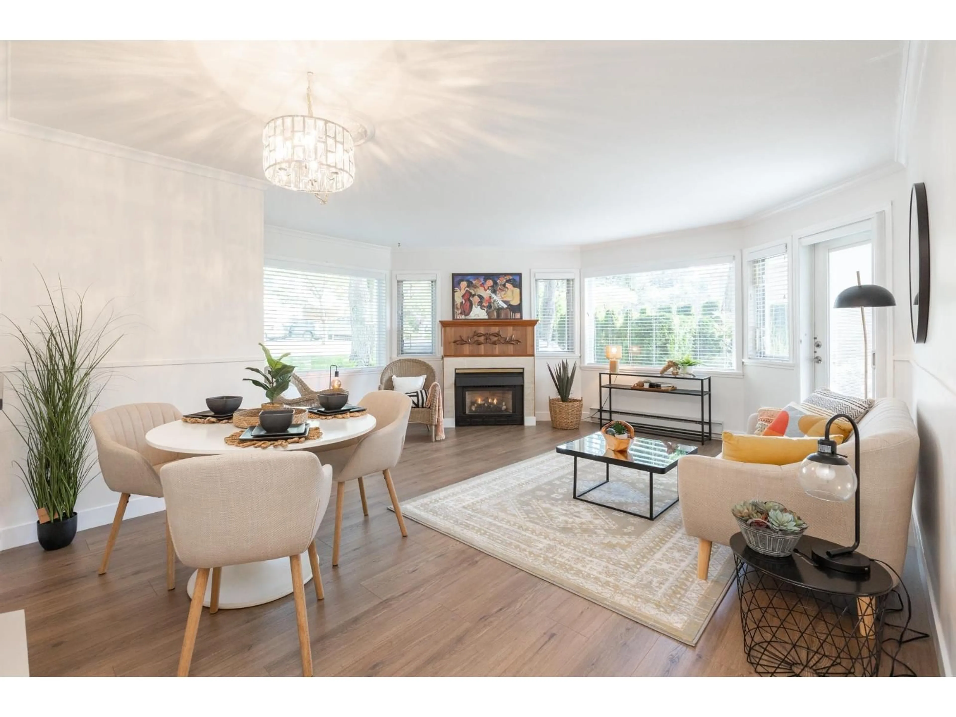 Living room with furniture, wood/laminate floor for 107 - 13965 16 AVENUE, Surrey British Columbia V4P1P8