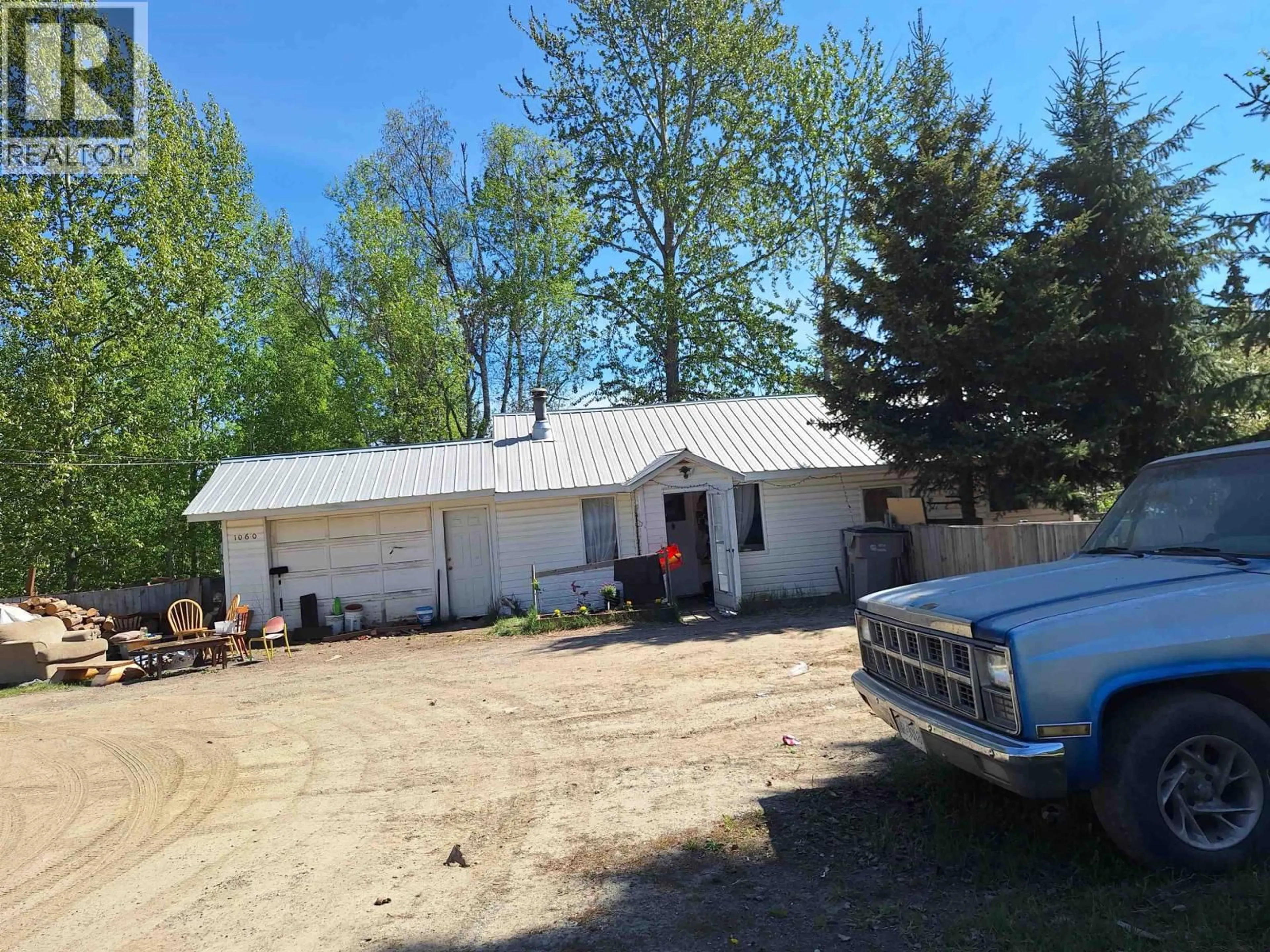 A pic from outside/outdoor area/front of a property/back of a property/a pic from drone, building for 2 - 1060 WEST FRASER ROAD, Quesnel British Columbia V2J6G7