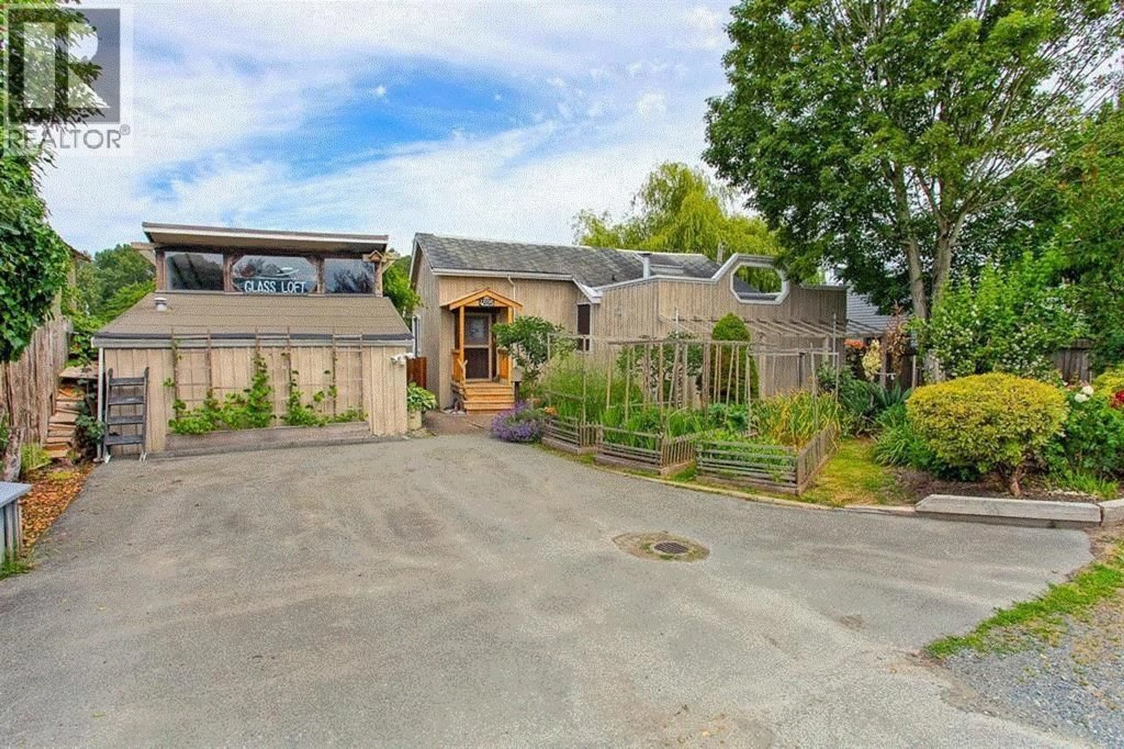 A pic from outside/outdoor area/front of a property/back of a property/a pic from drone, street for 4525 RIVER ROAD, Delta British Columbia V4K1R9