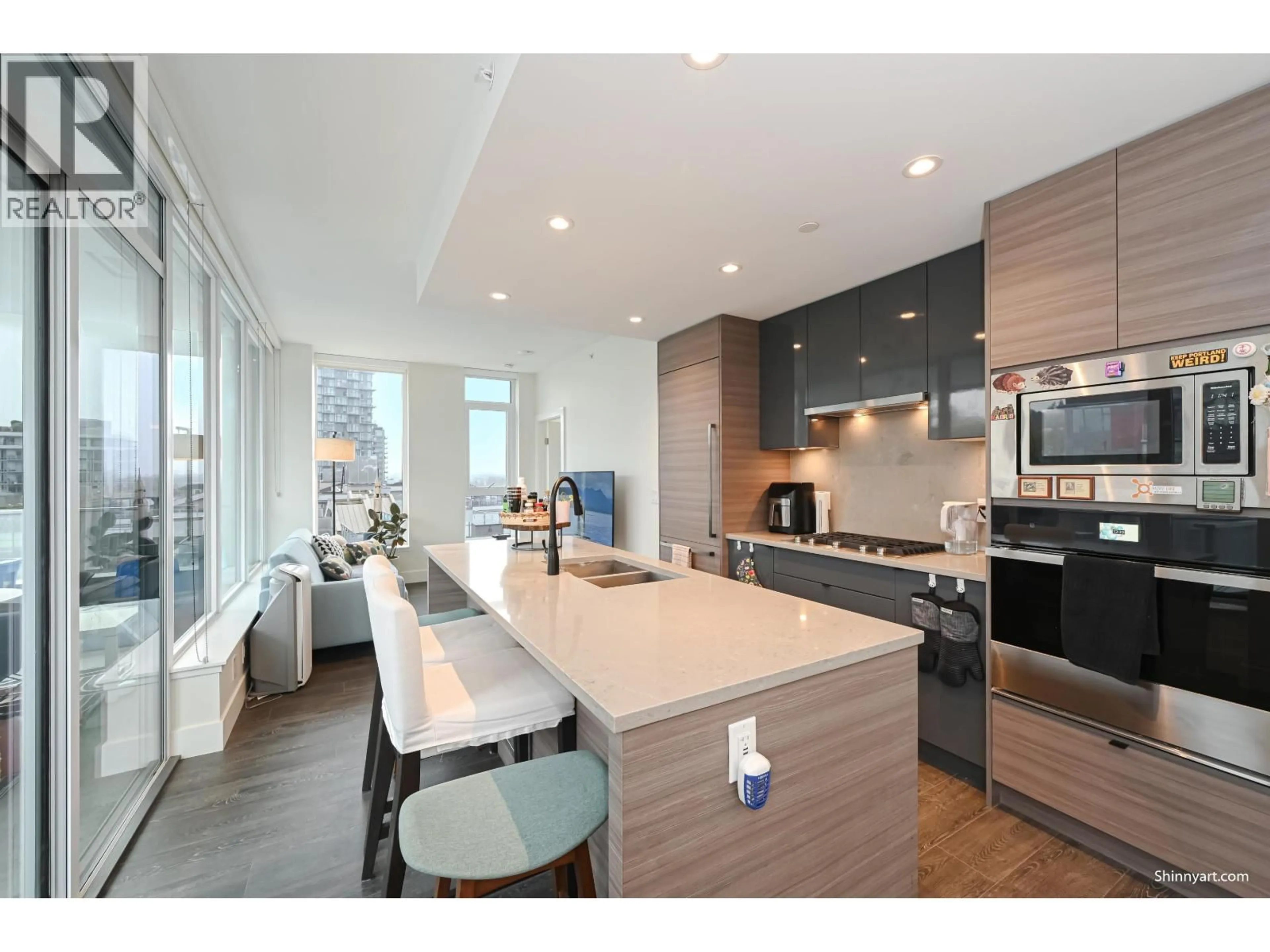 Open concept kitchen, wood/laminate floor for 807 - 3438 SAWMILL CRESCENT, Vancouver British Columbia V5S0E3