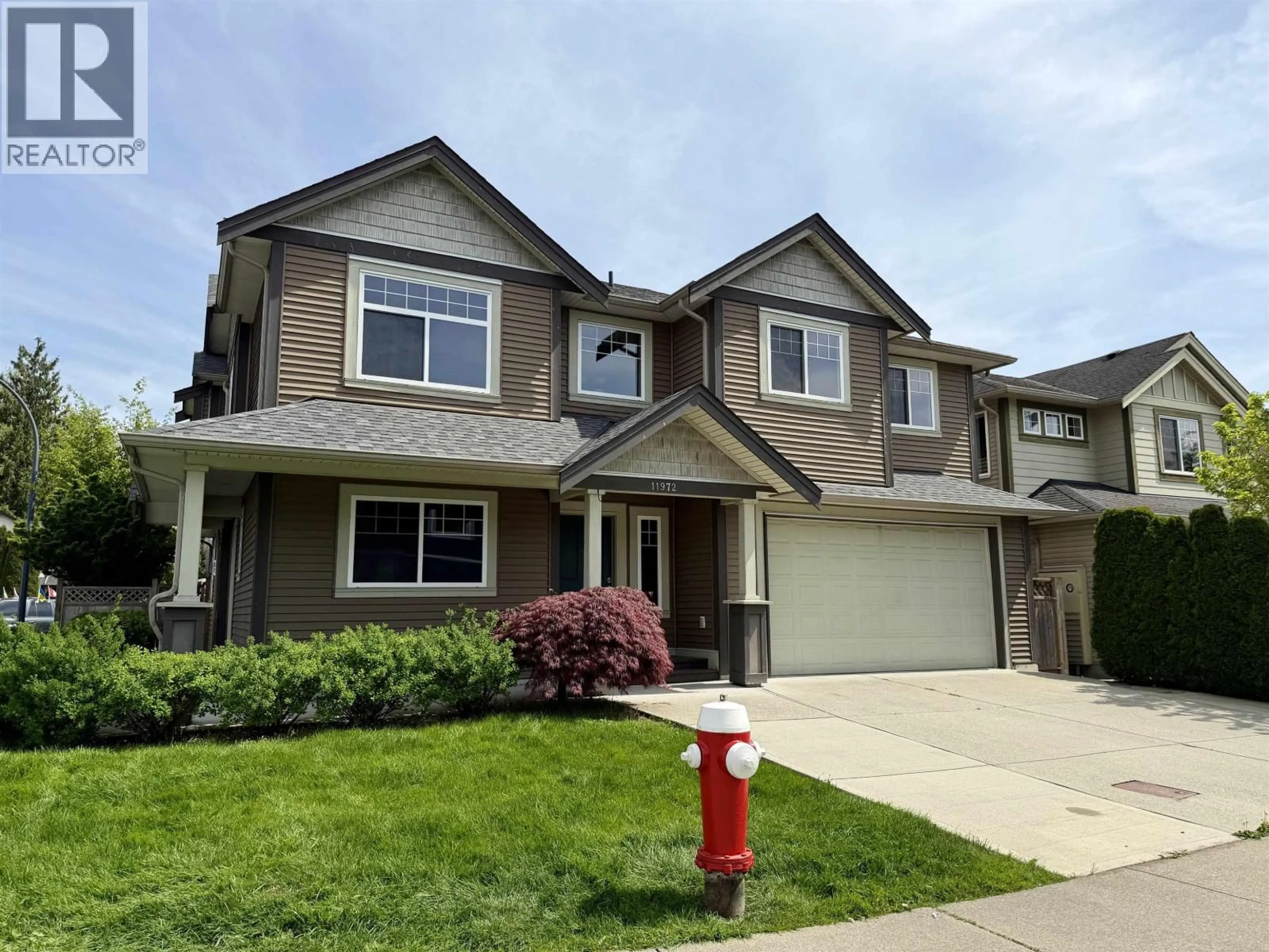 Home with vinyl exterior material, street for 11972 239 STREET, Maple Ridge British Columbia V4R1W4