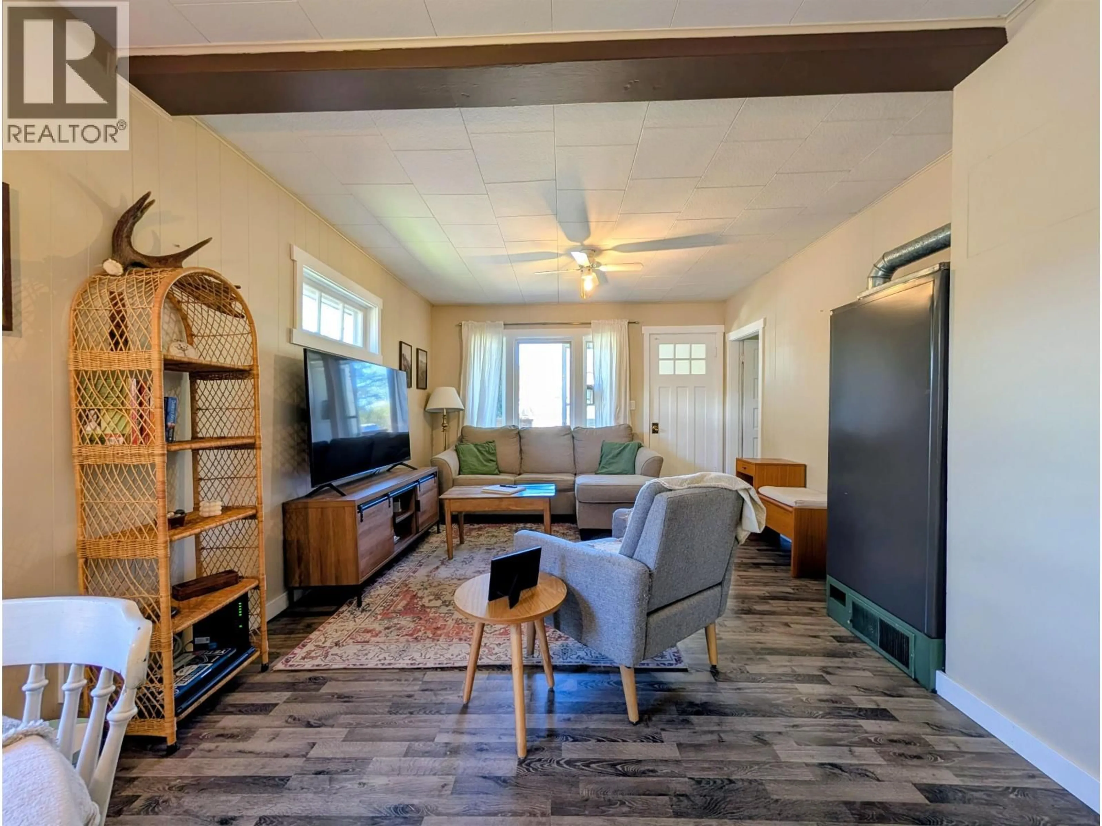Living room with furniture, wood/laminate floor for 3923 FIRST AVENUE, Smithers British Columbia V0J2N0