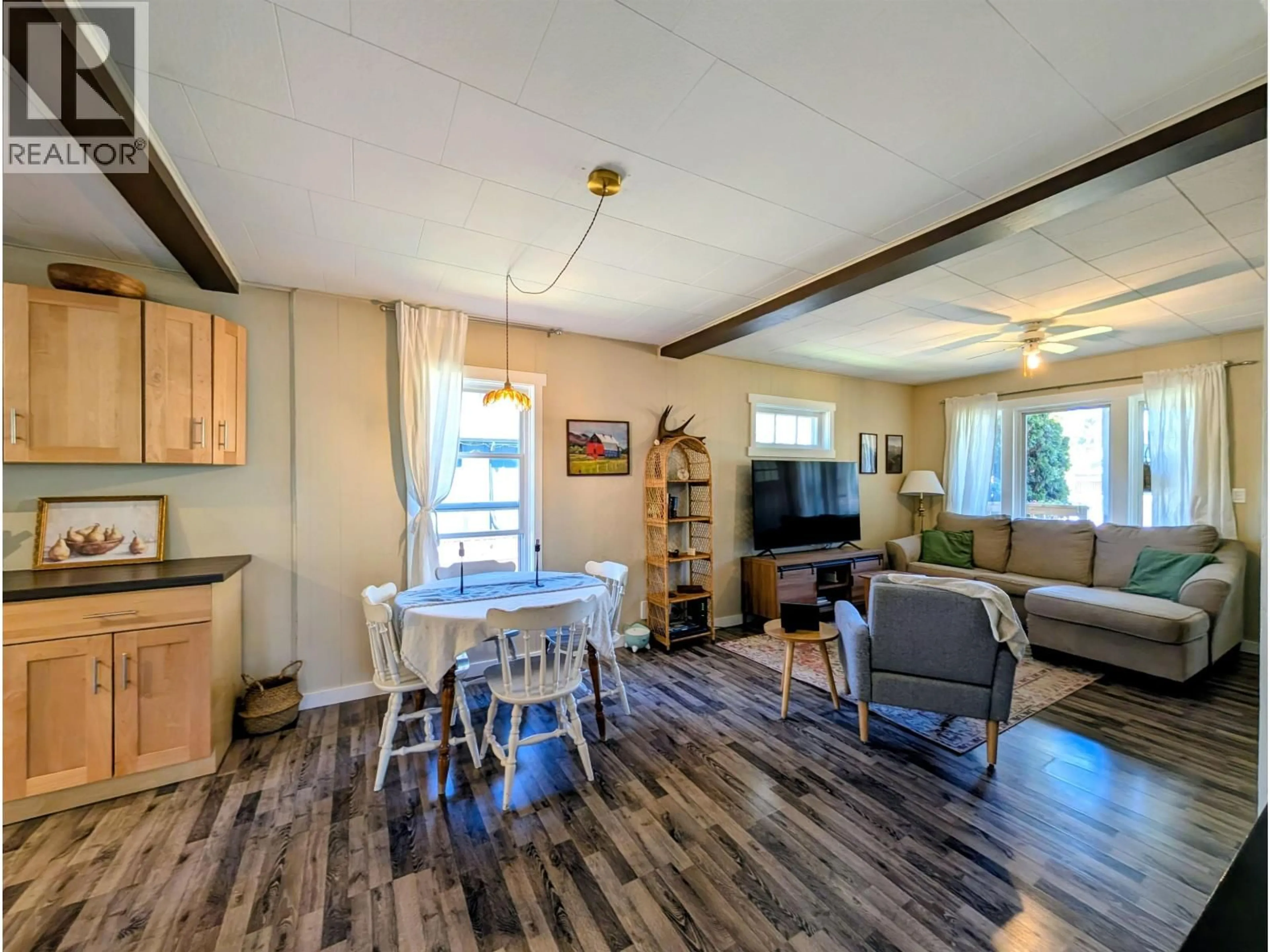 Living room with furniture, wood/laminate floor for 3923 FIRST AVENUE, Smithers British Columbia V0J2N0