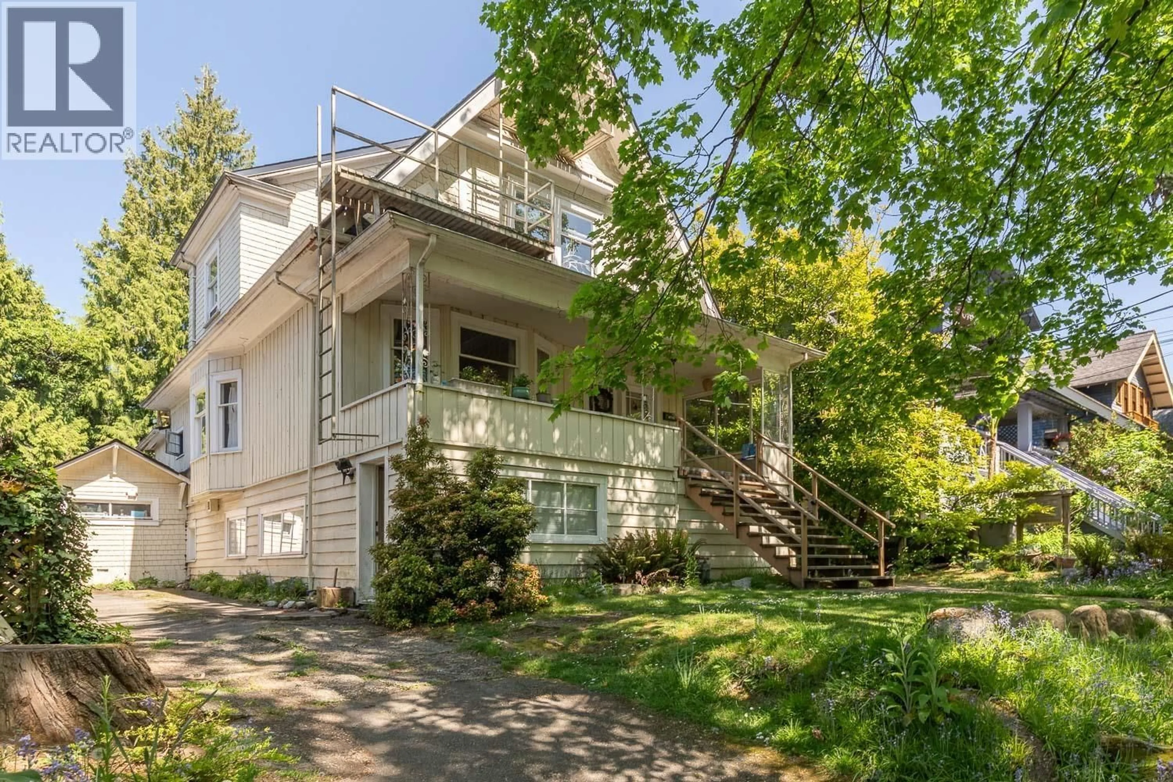 Home with vinyl exterior material, street for 2483 6TH AVENUE, Vancouver British Columbia V6K1W2