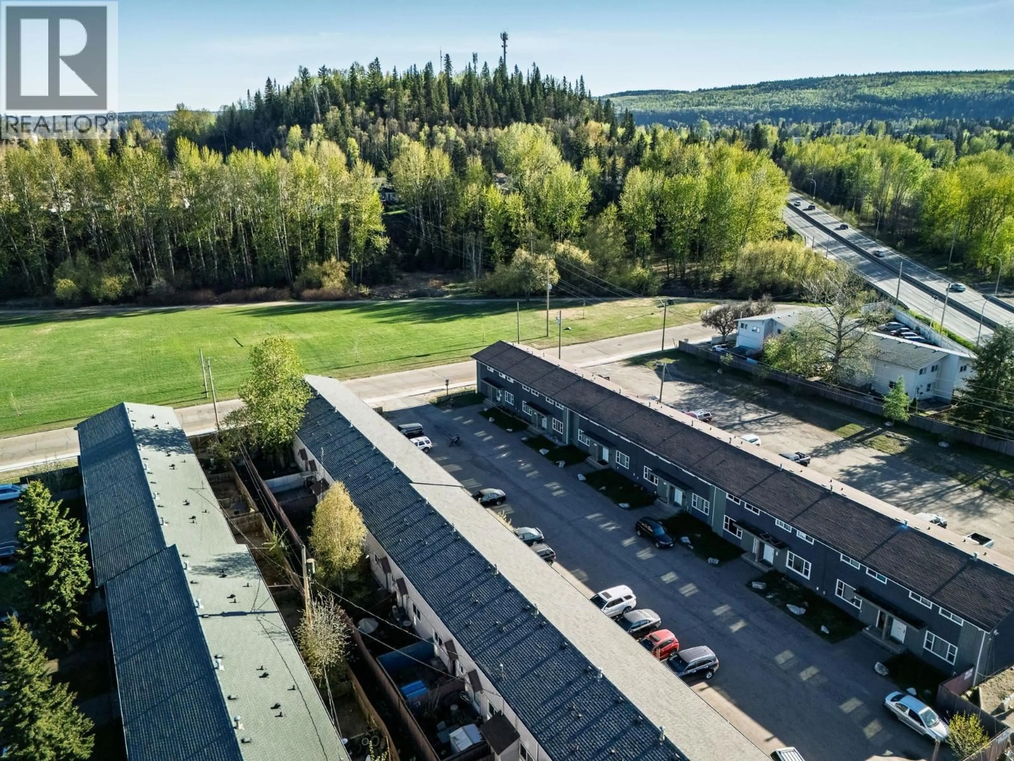 A pic from outside/outdoor area/front of a property/back of a property/a pic from drone, unknown for H104 - 1900 STRATHCONA AVENUE, Prince George British Columbia V2L2V9
