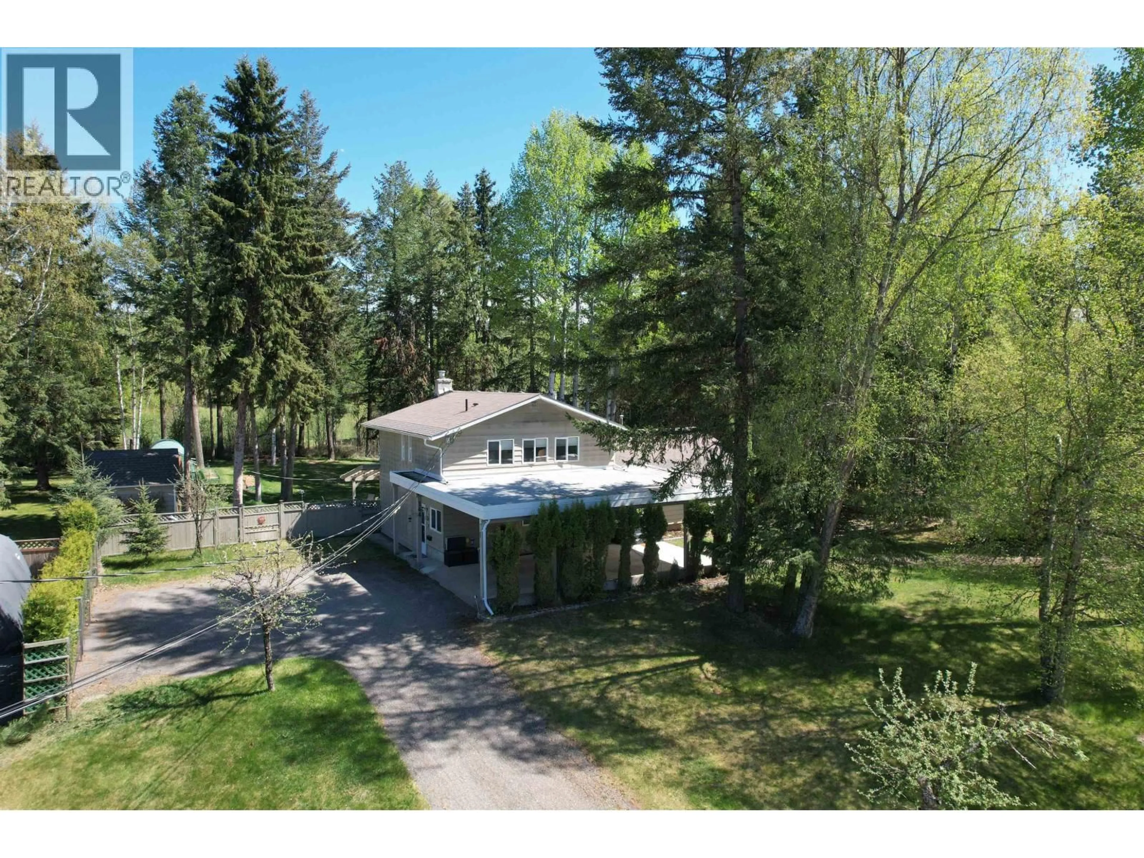 A pic from outside/outdoor area/front of a property/back of a property/a pic from drone, forest/trees view for 144 ENEMARK ROAD, Quesnel British Columbia V2J4W6