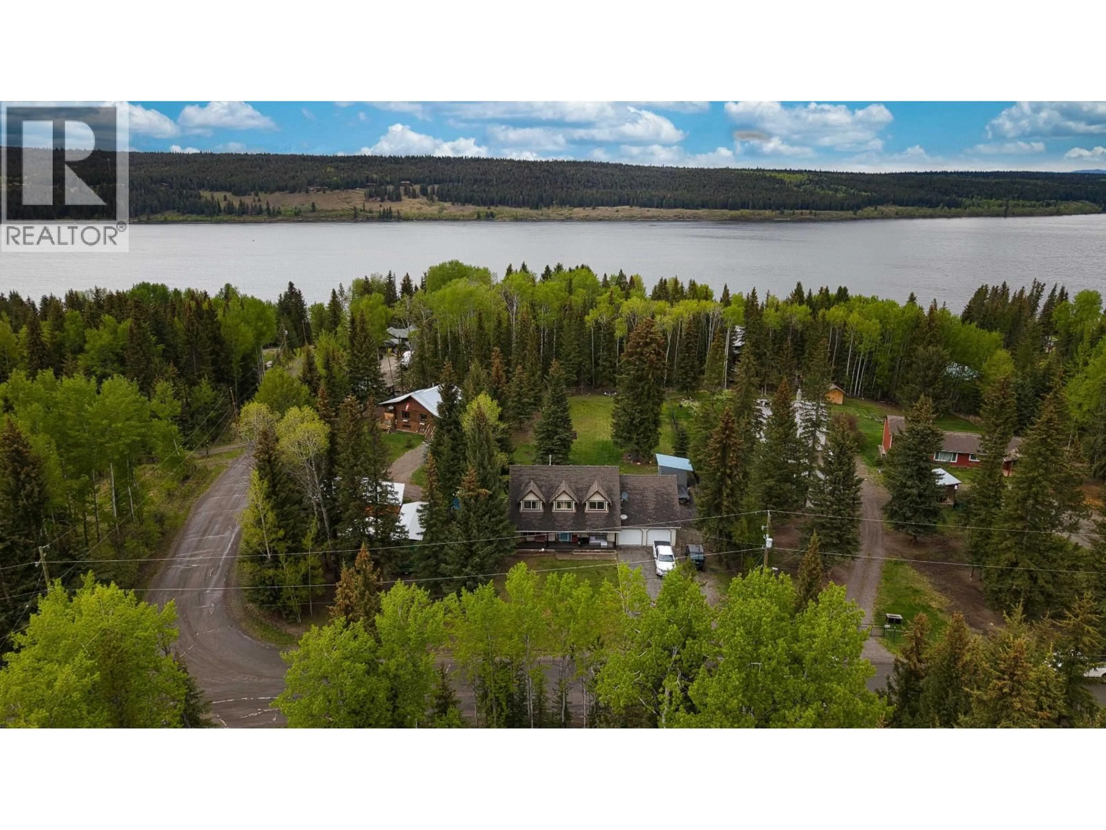 A pic from outside/outdoor area/front of a property/back of a property/a pic from drone, water/lake/river/ocean view for 6341 WOLFE ROAD, 100 Mile House British Columbia V0K2E3