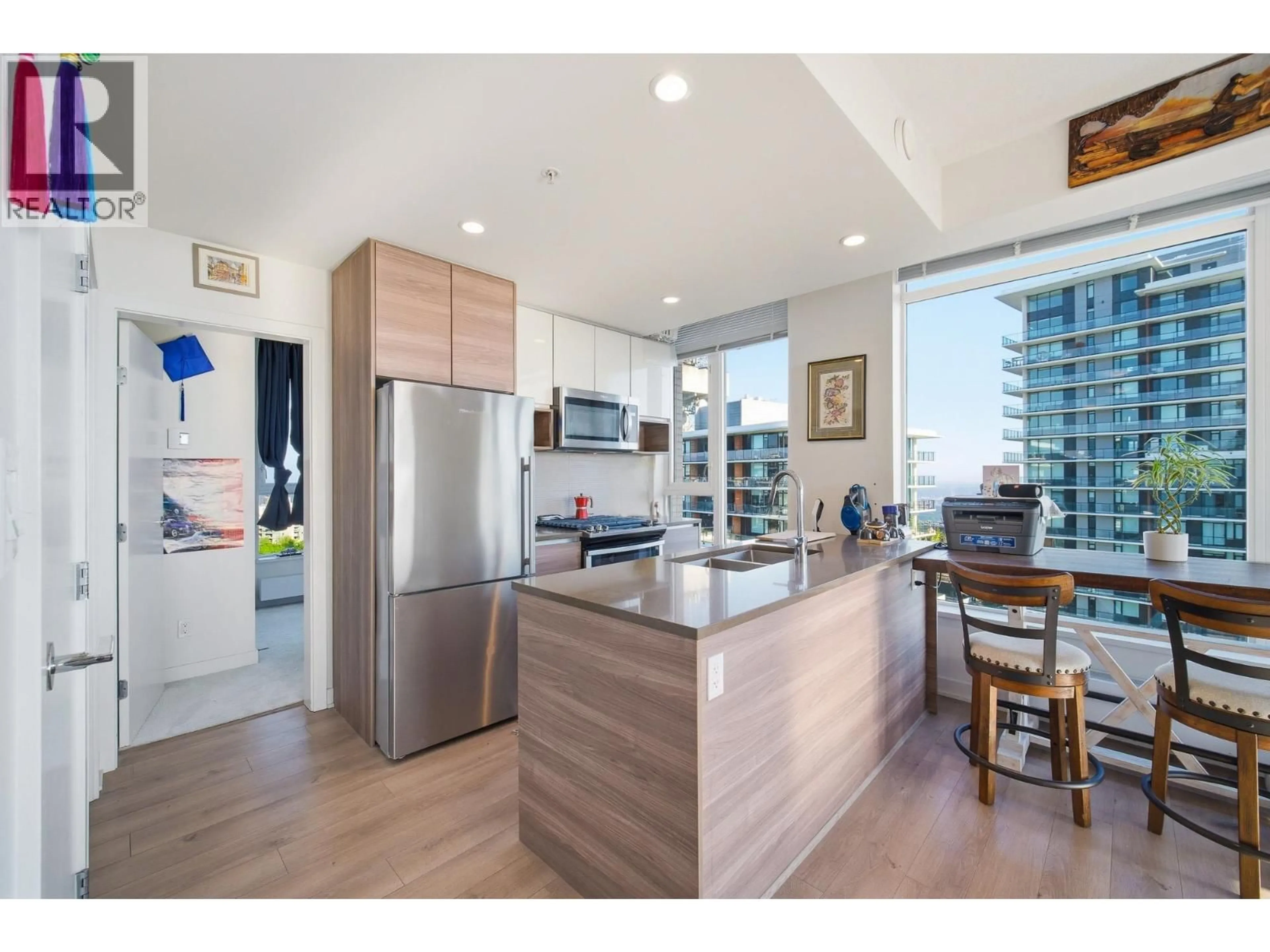 Open concept kitchen, wood/laminate floor for 1308 - 8850 UNIVERSITY CRESCENT, Burnaby British Columbia V5A0C8