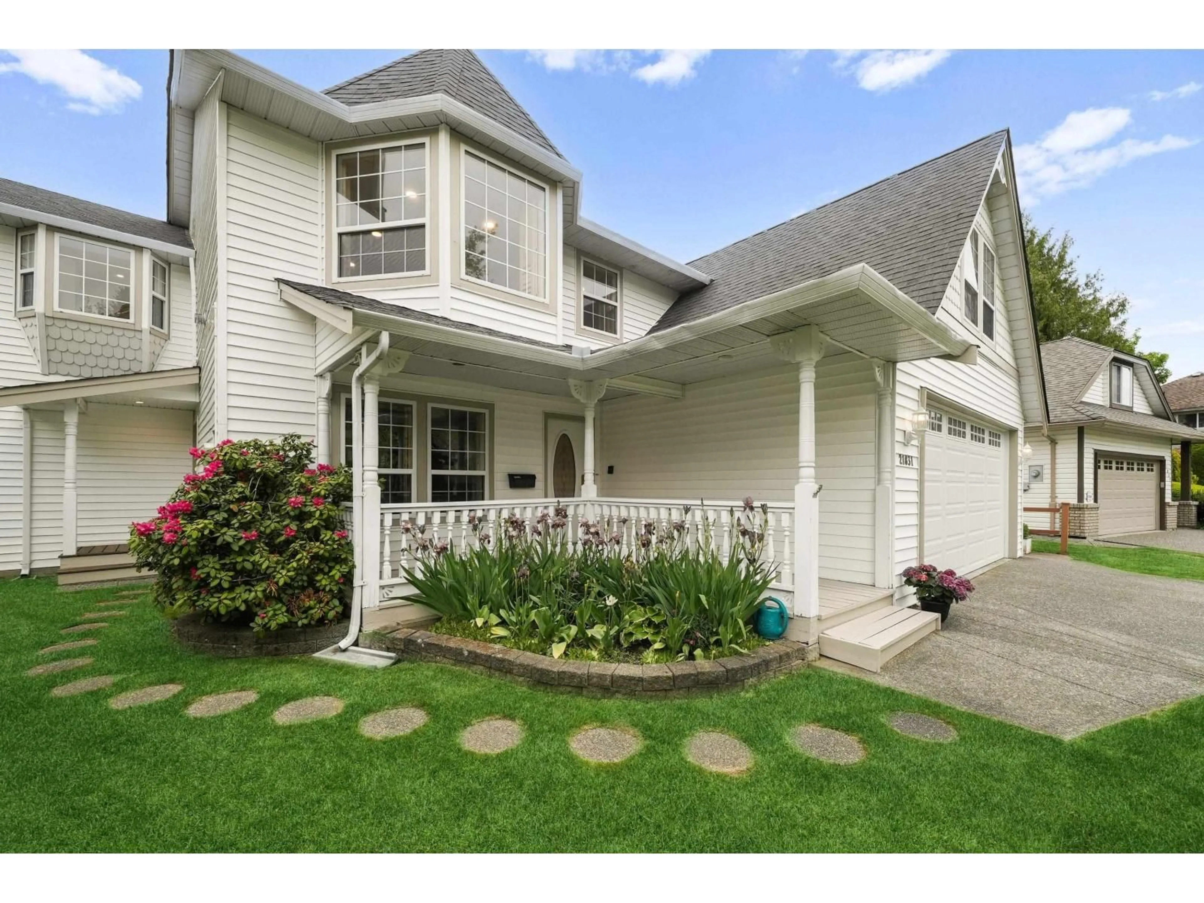 Home with vinyl exterior material, street for 21831 44A AVENUE, Langley British Columbia V3A8E1