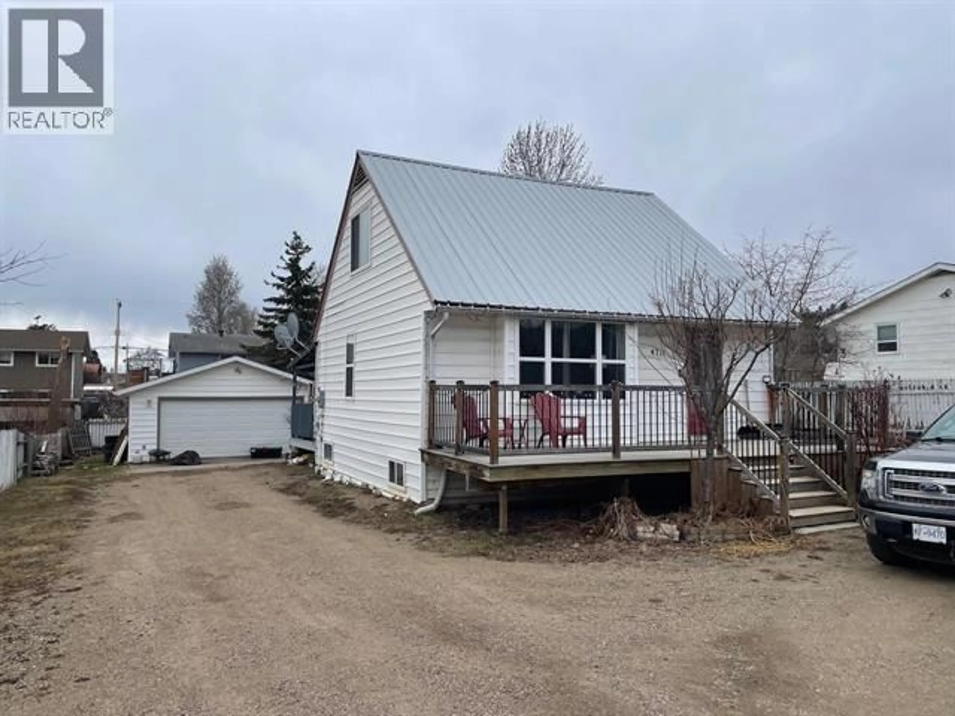 A pic from outside/outdoor area/front of a property/back of a property/a pic from drone, street for 4711 SPRUCE AVENUE, Fort Nelson British Columbia V0C1R0