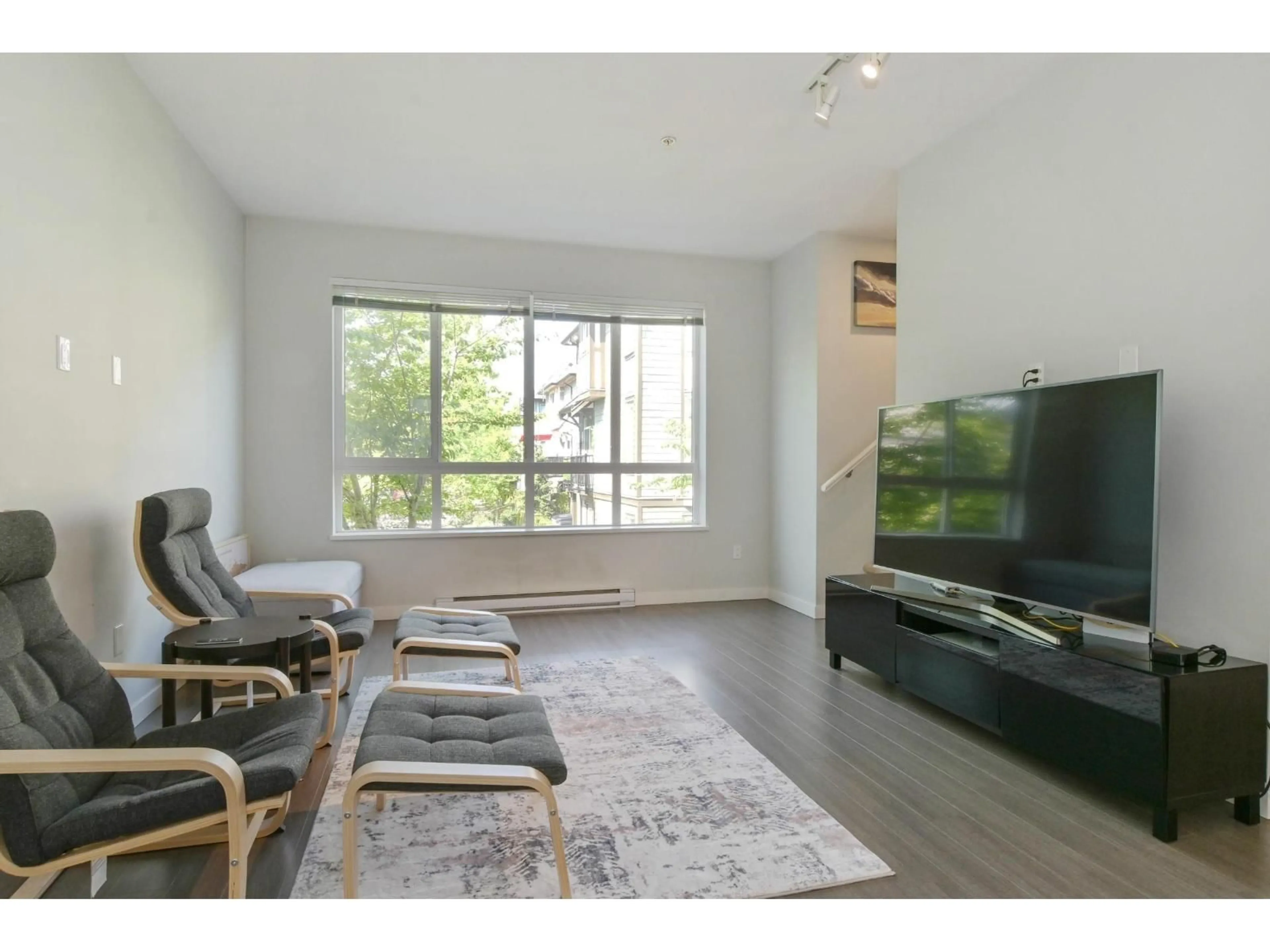 Living room with furniture, wood/laminate floor for 44 - 8138 204 STREET, Langley British Columbia V2Y0T4