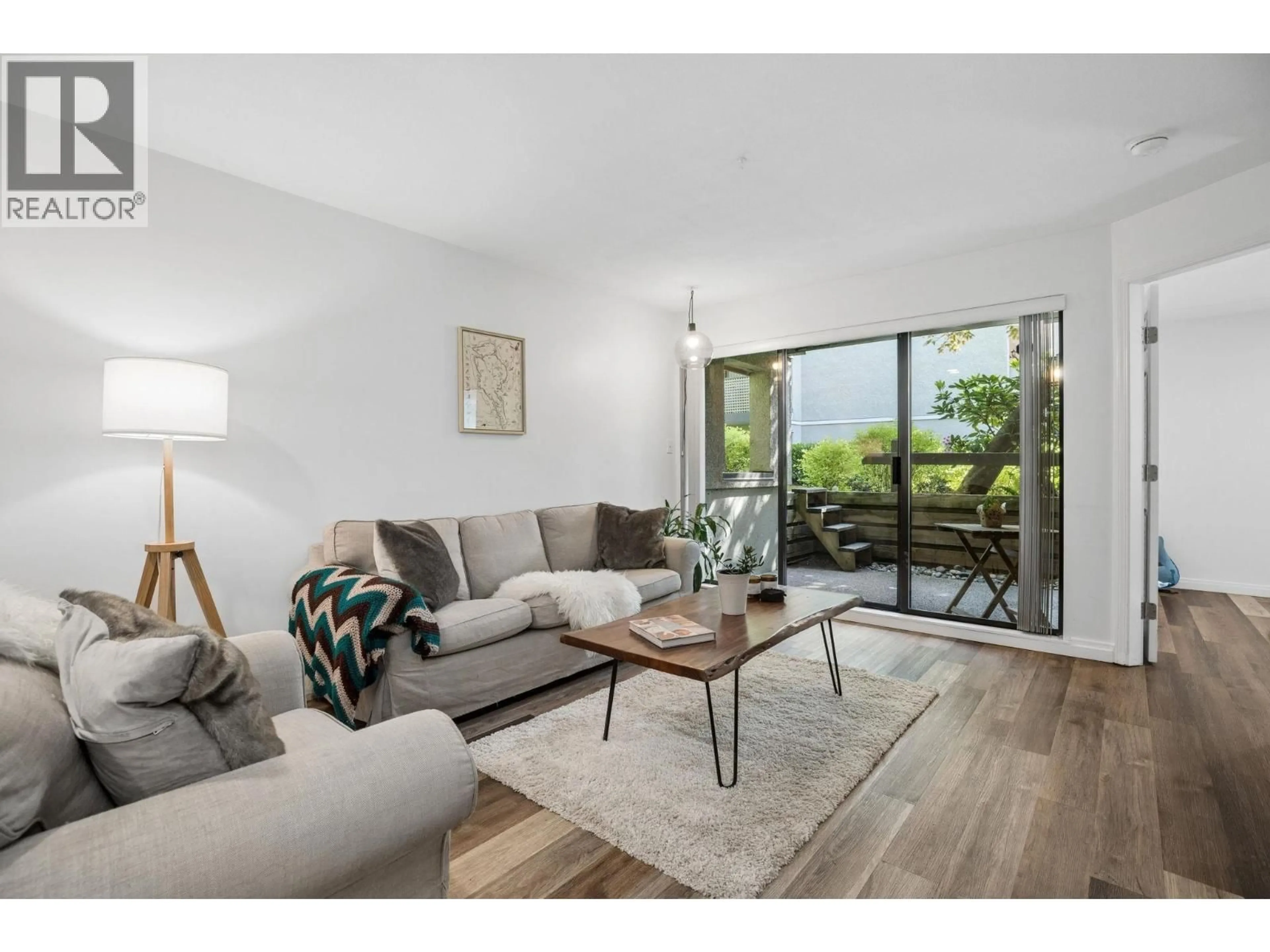 Living room with furniture, wood/laminate floor for 108 - 1200 PACIFIC STREET, Coquitlam British Columbia V3B6K2