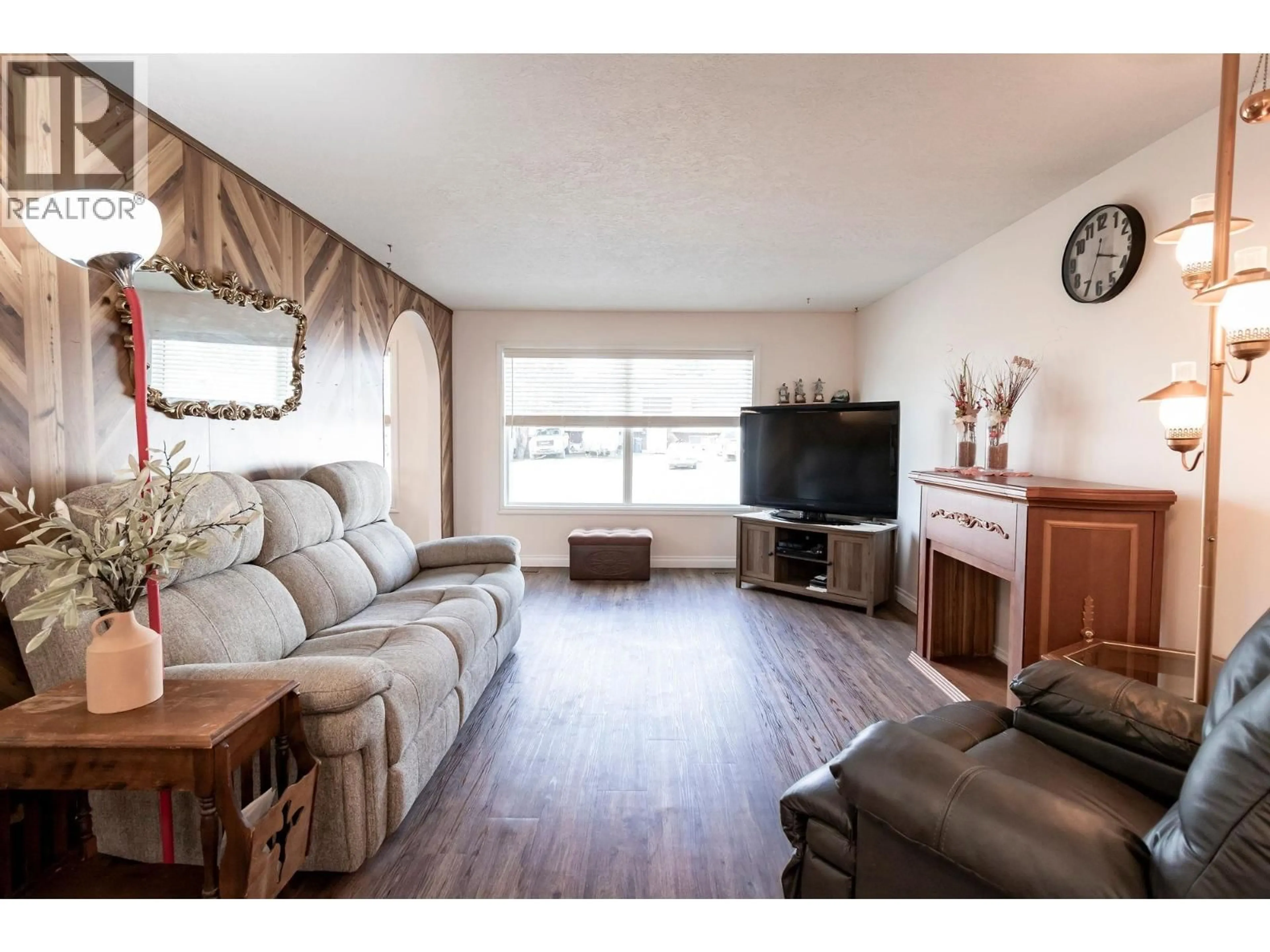 Living room with furniture, wood/laminate floor for 10311 103 AVENUE, Fort St. John British Columbia V1J2H7