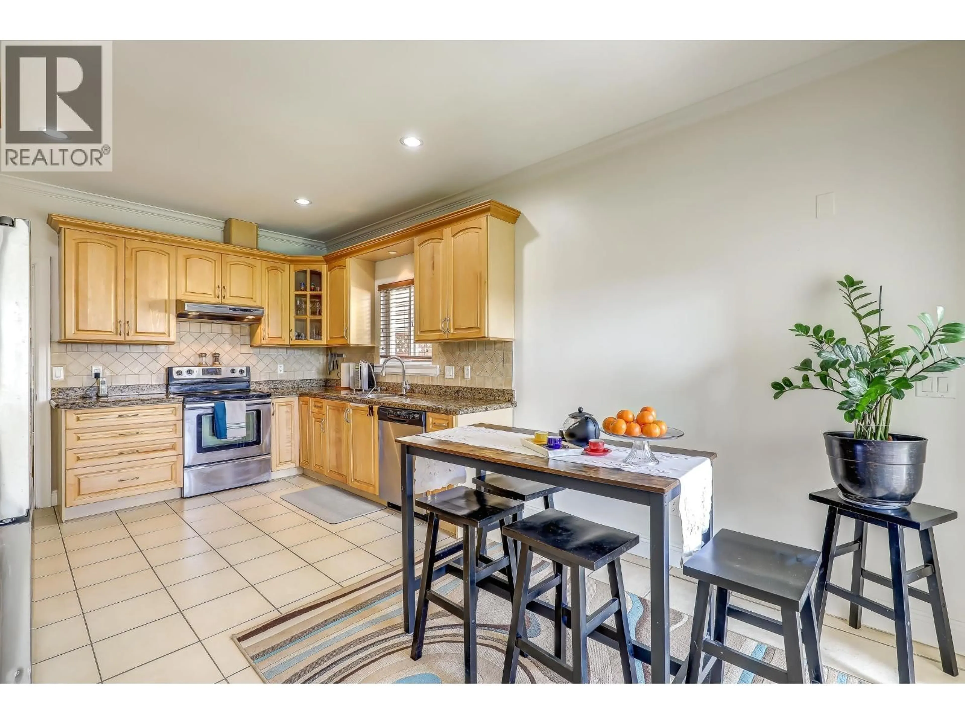 Open concept kitchen, ceramic/tile floor for 7448 17TH AVE AVENUE, Burnaby British Columbia V3N1L4