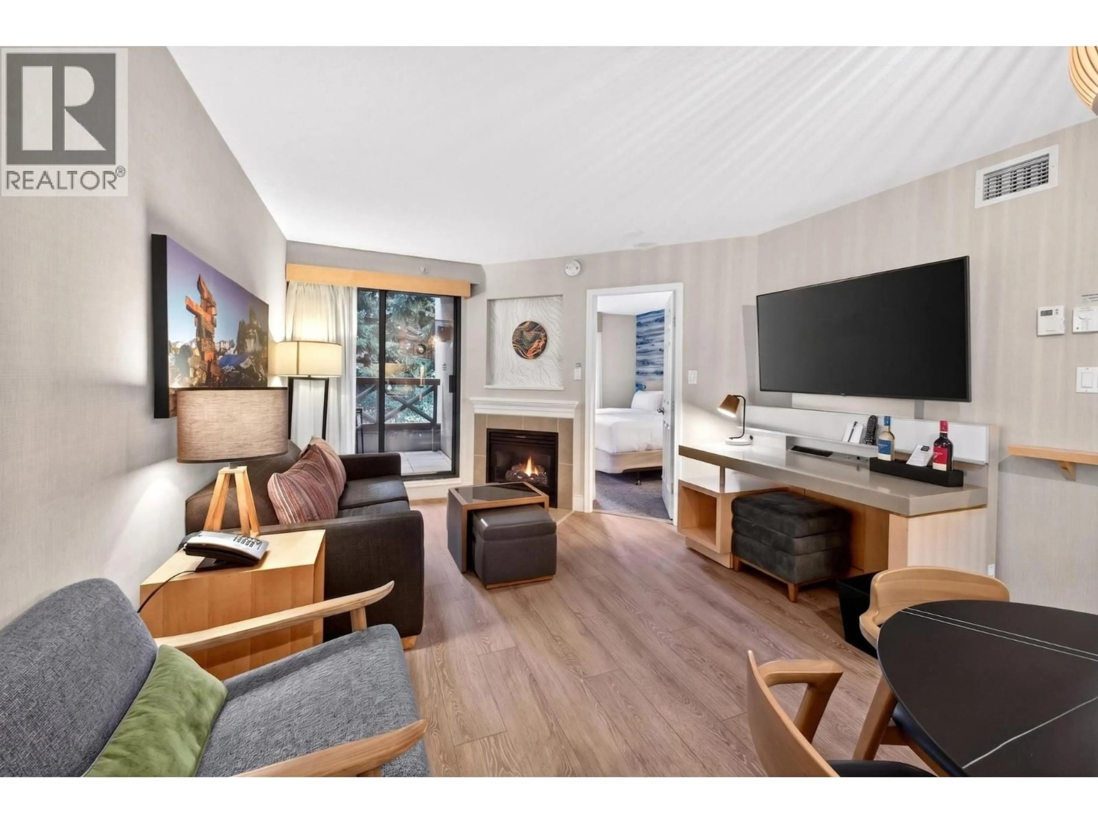 Living room with furniture, wood/laminate floor for 1211 - 4308 MAIN STREET, Whistler British Columbia V8E1A9