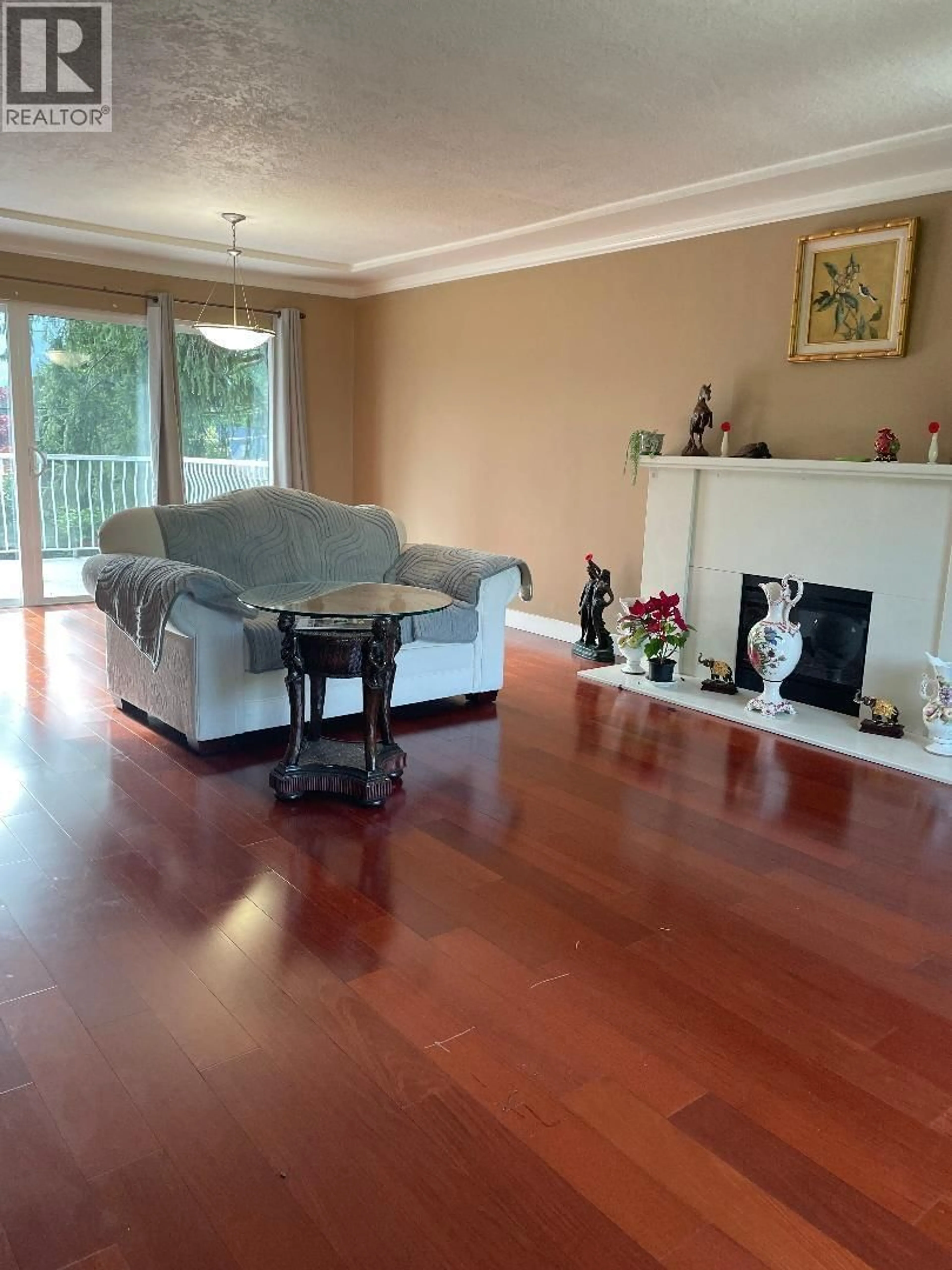Living room with furniture, wood/laminate floor for 4497 CANTERBURY CRESCENT, North Vancouver British Columbia V7R3N8