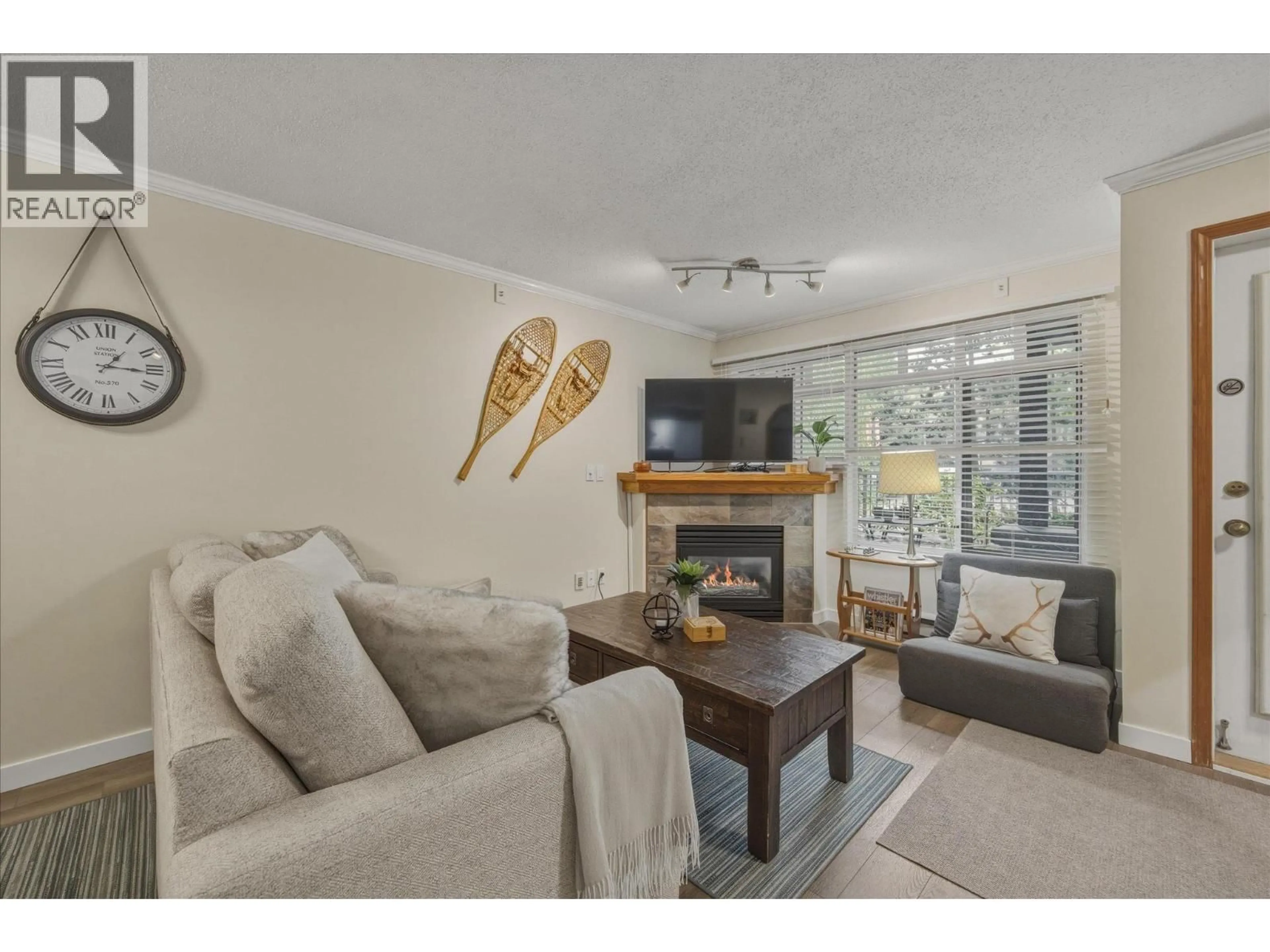 Living room with furniture, wood/laminate floor for 69 - 4335 NORTHLANDS BOULEVARD, Whistler British Columbia V0N1B4