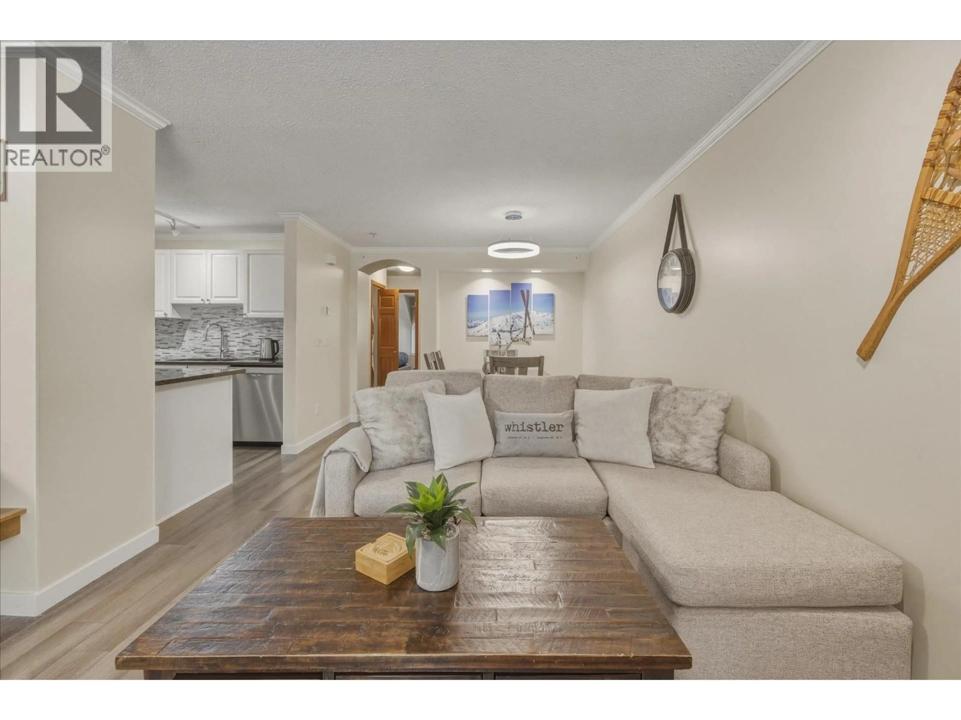 Living room with furniture, wood/laminate floor for 69 - 4335 NORTHLANDS BOULEVARD, Whistler British Columbia V0N1B4