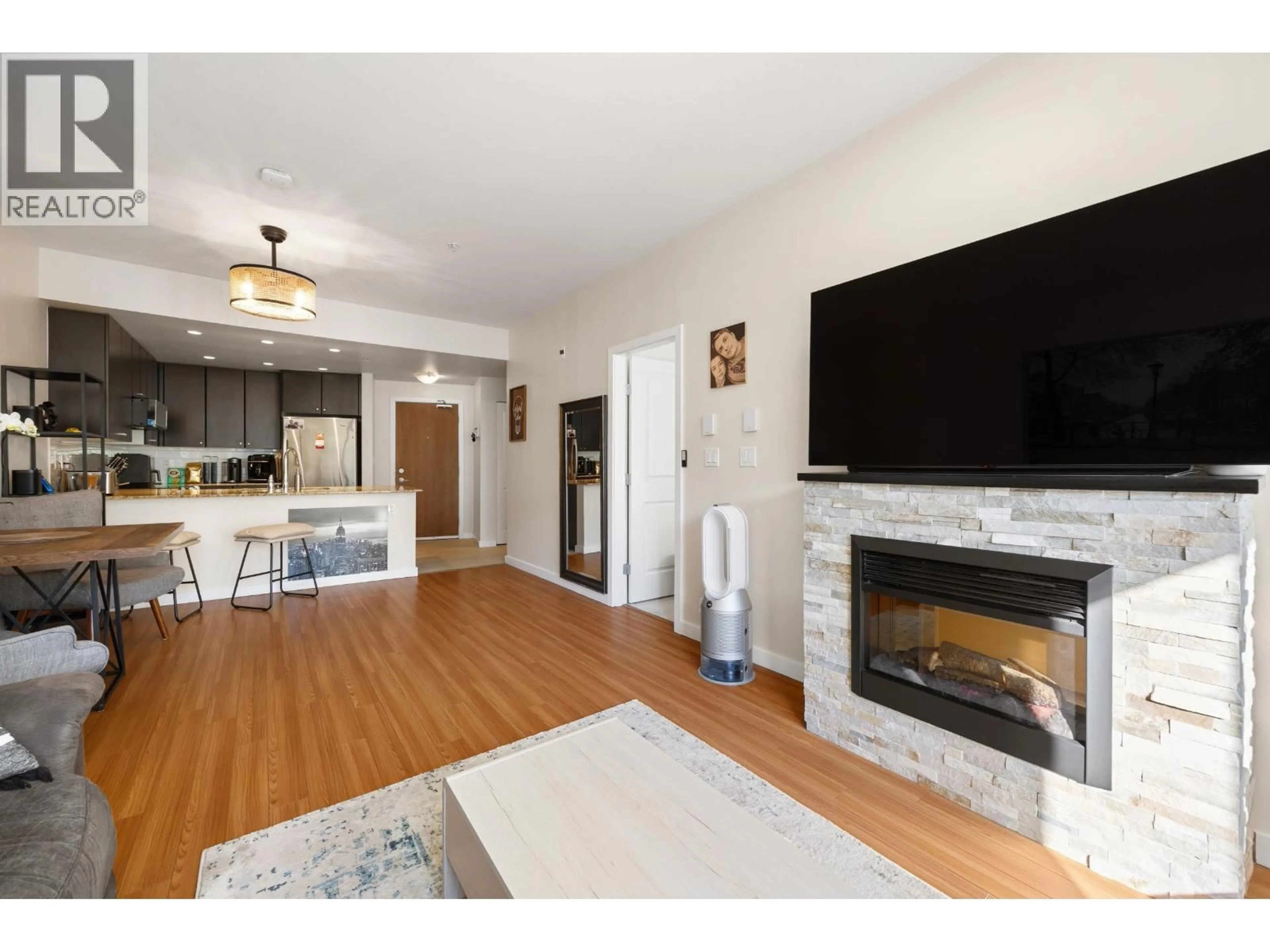 Living room with furniture, wood/laminate floor for 304 - 225 FRANCIS WAY, New Westminster British Columbia V3L0G1