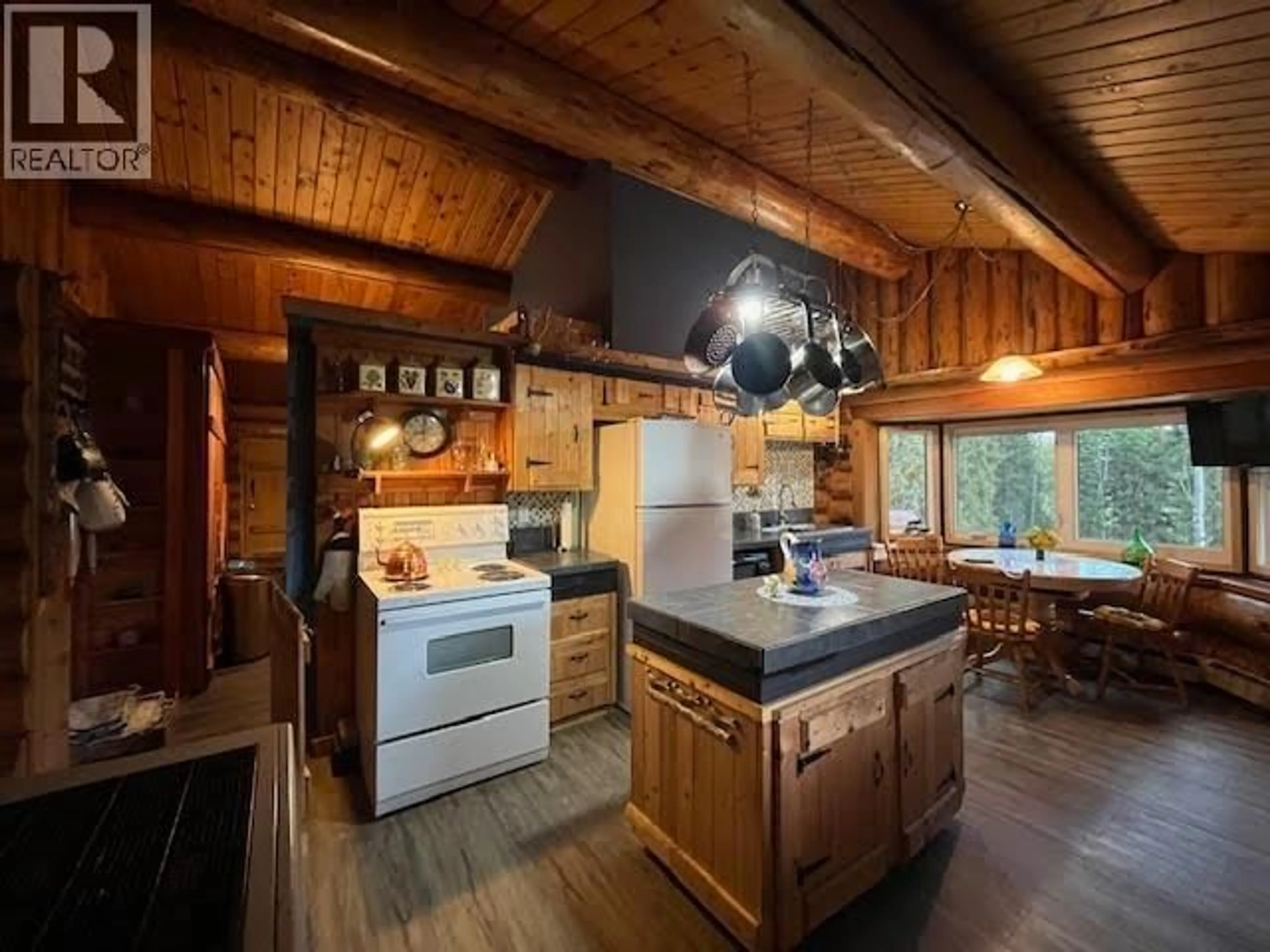 Rustic kitchen, wood/laminate floor for 6006 VALLEYVIEW DRIVE, 100 Mile House British Columbia V0K2E3