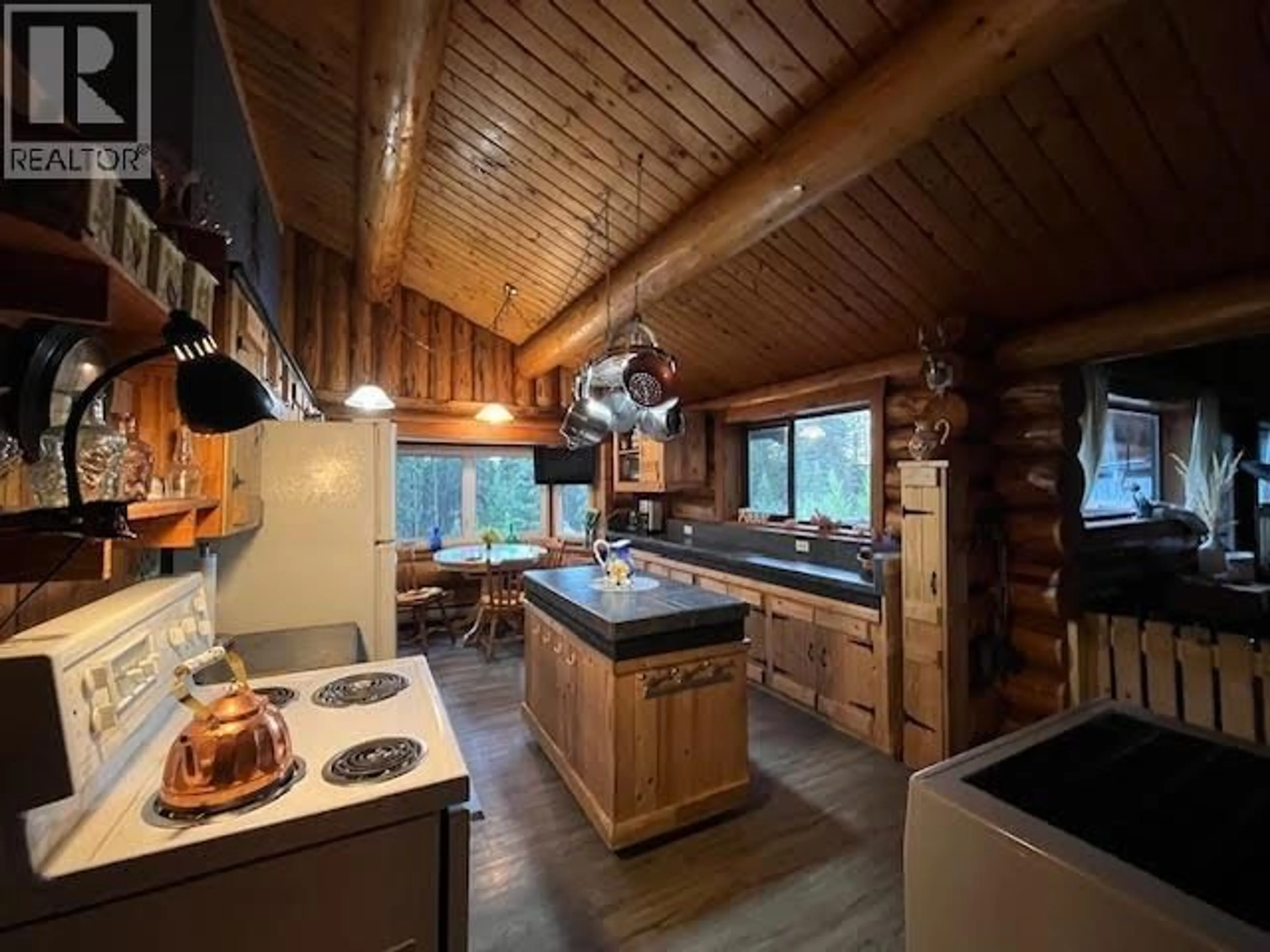 Rustic kitchen, wood/laminate floor for 6006 VALLEYVIEW DRIVE, 100 Mile House British Columbia V0K2E3