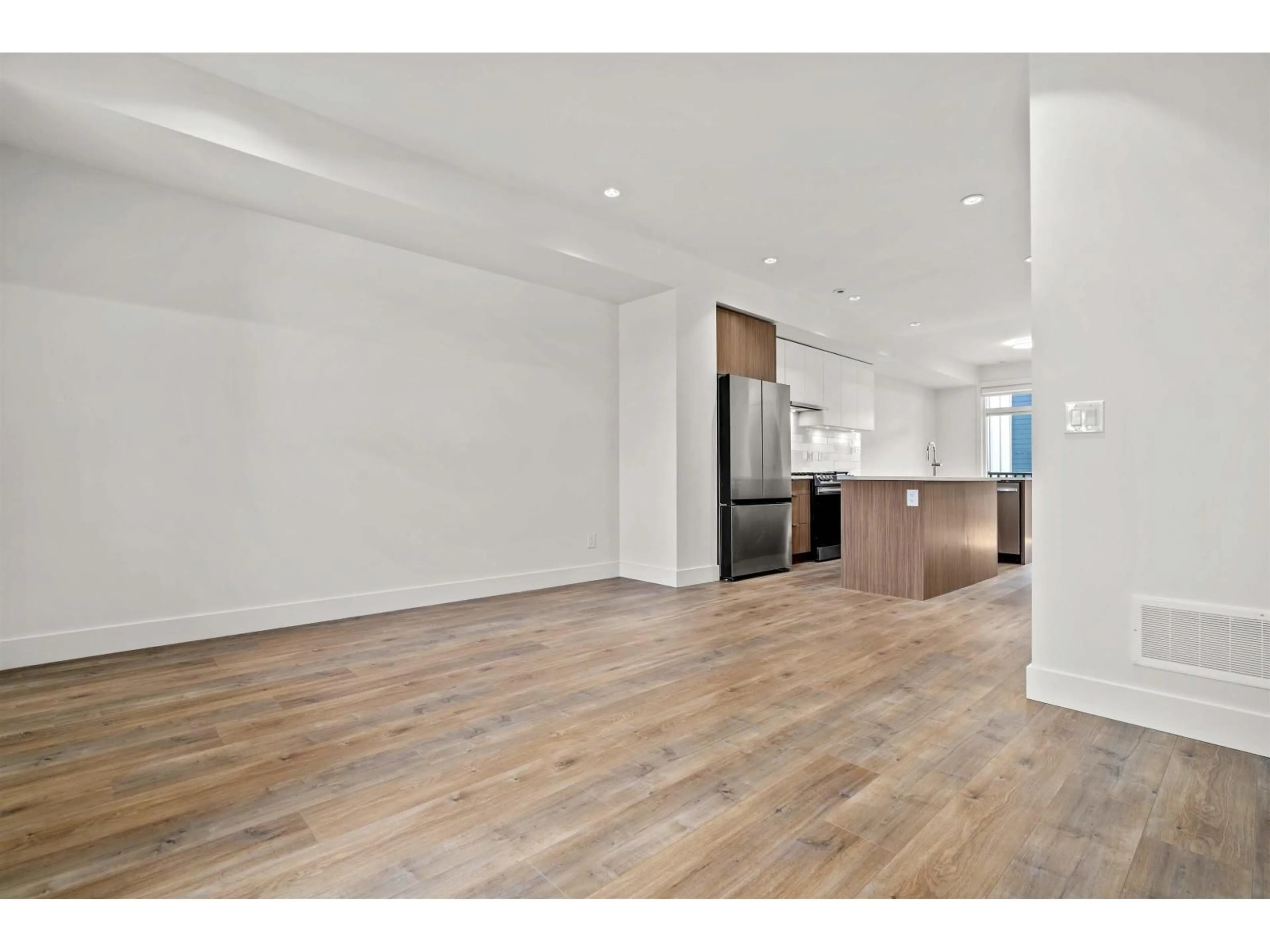 Open concept kitchen, wood/laminate floor for 57 - 11556 72A AVENUE, Delta British Columbia V4C1A9