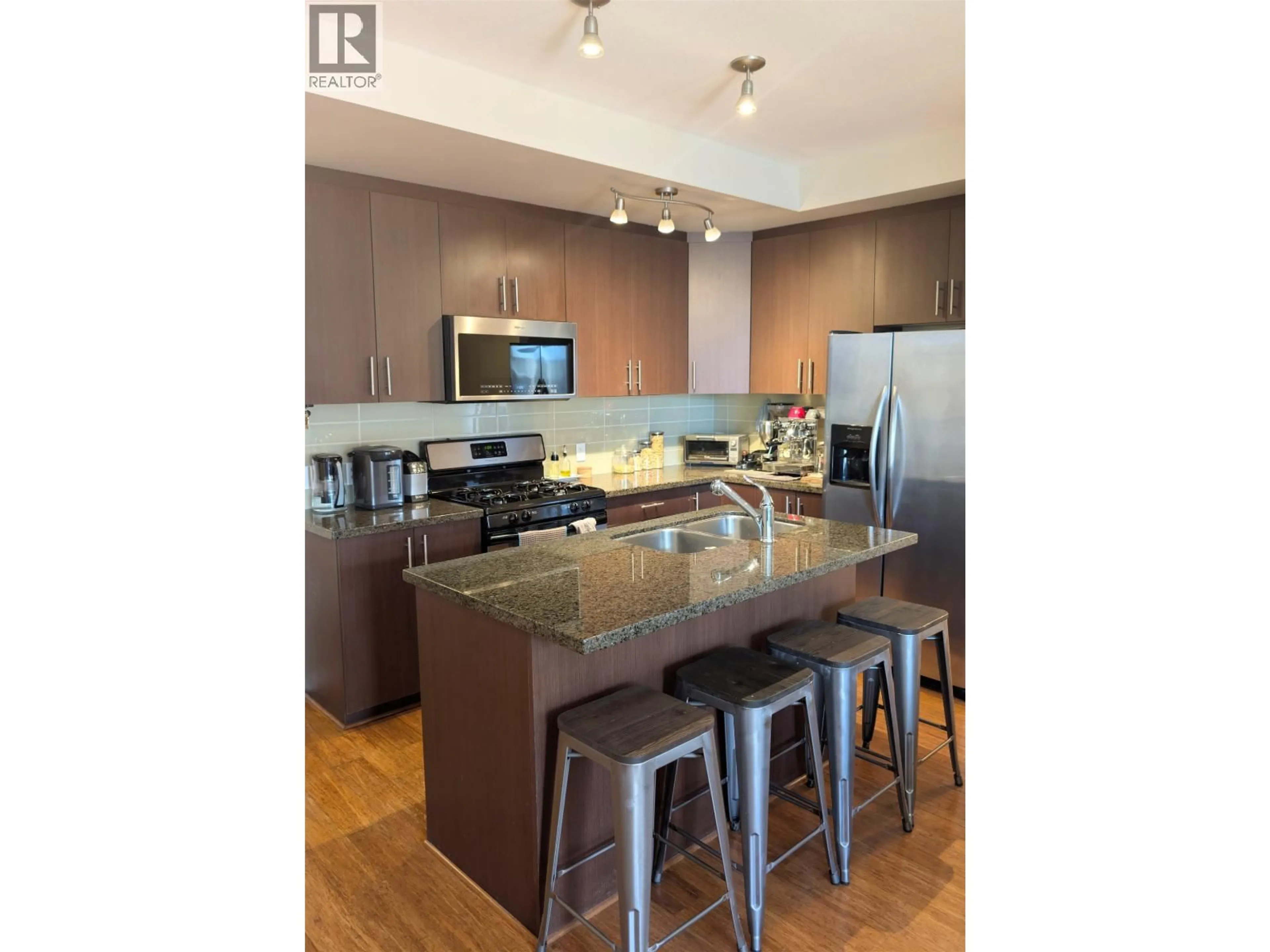 Open concept kitchen, wood/laminate floor for 206 - 6077 LONDON ROAD, Richmond British Columbia V7E0A7