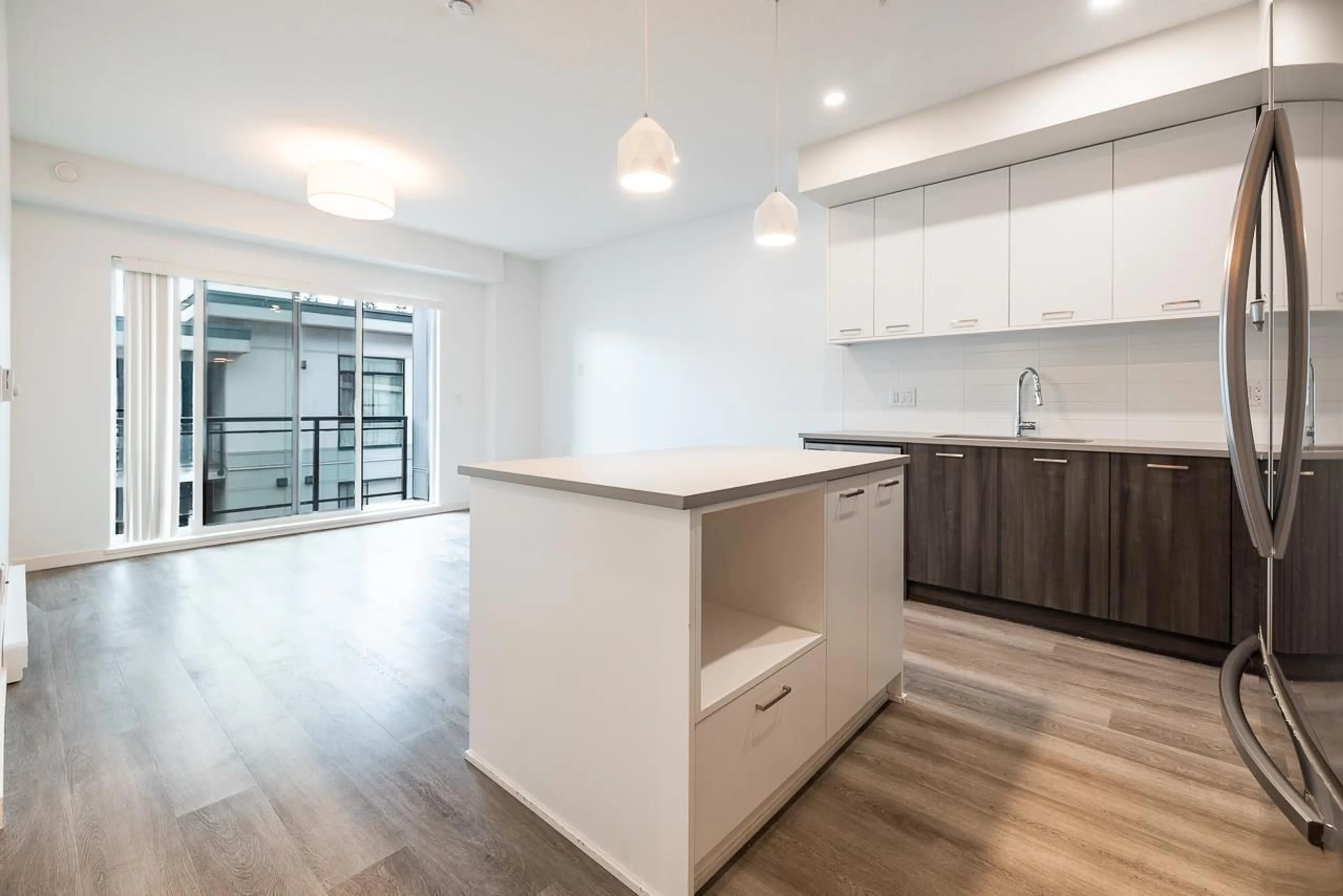 Open concept kitchen, wood/laminate floor for B203 - 20087 68 AVENUE, Langley British Columbia V2Y0Y3