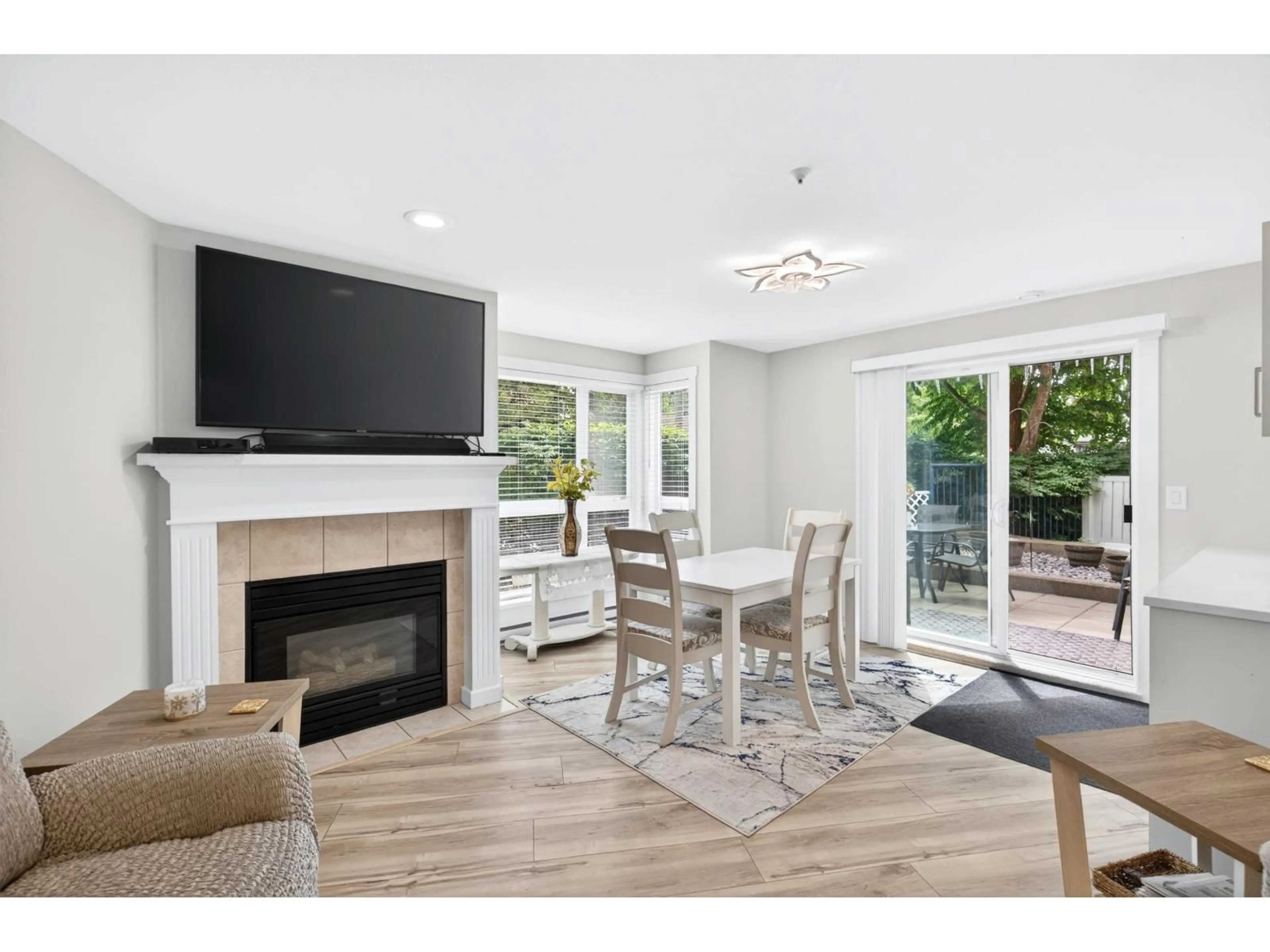 Living room with furniture, wood/laminate floor for #101 - 20245 53 AVENUE, Langley British Columbia V3A3V2