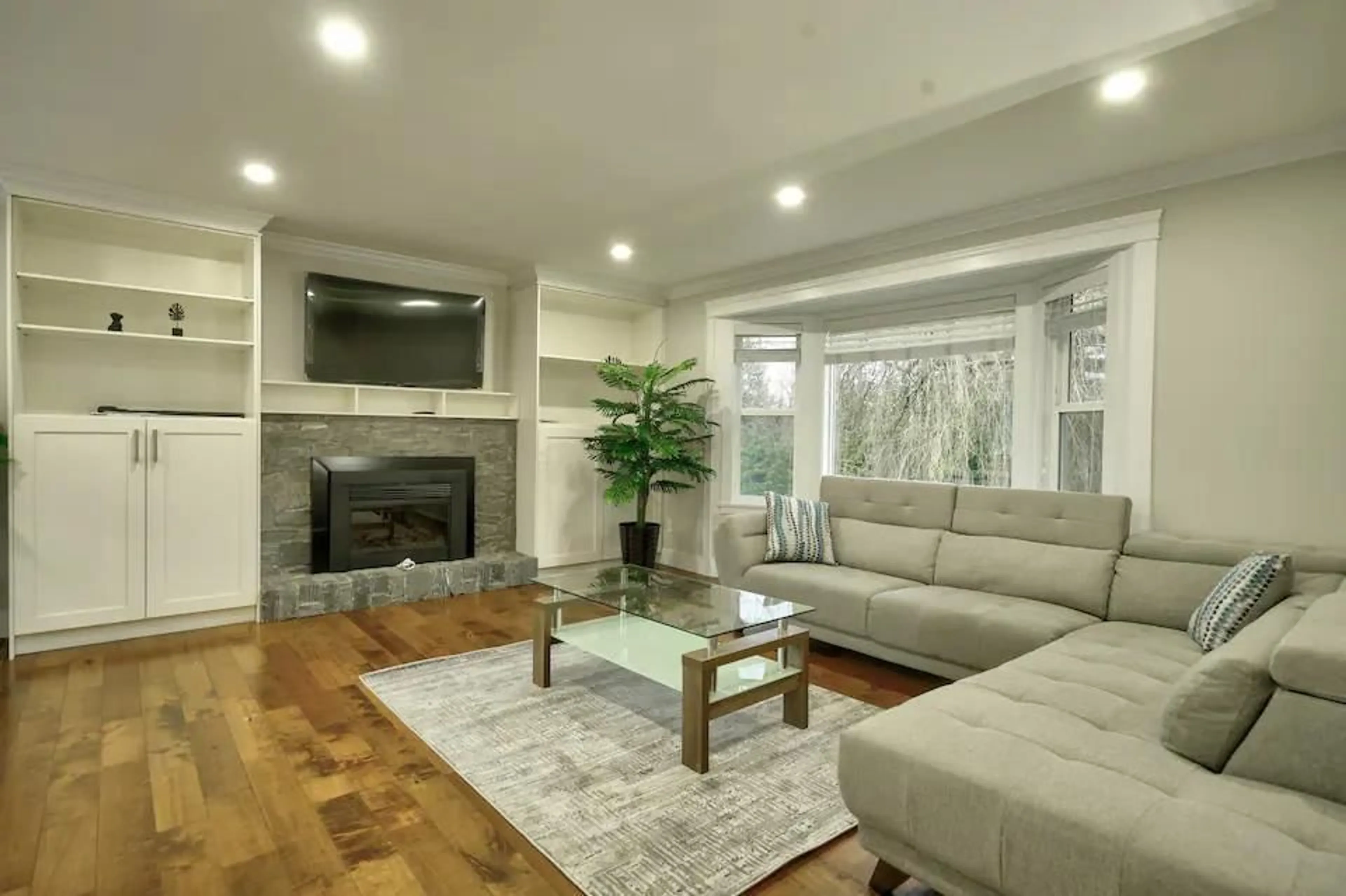 Living room with furniture, wood/laminate floor for 18369 21A AVENUE, Surrey British Columbia V3Z9W2